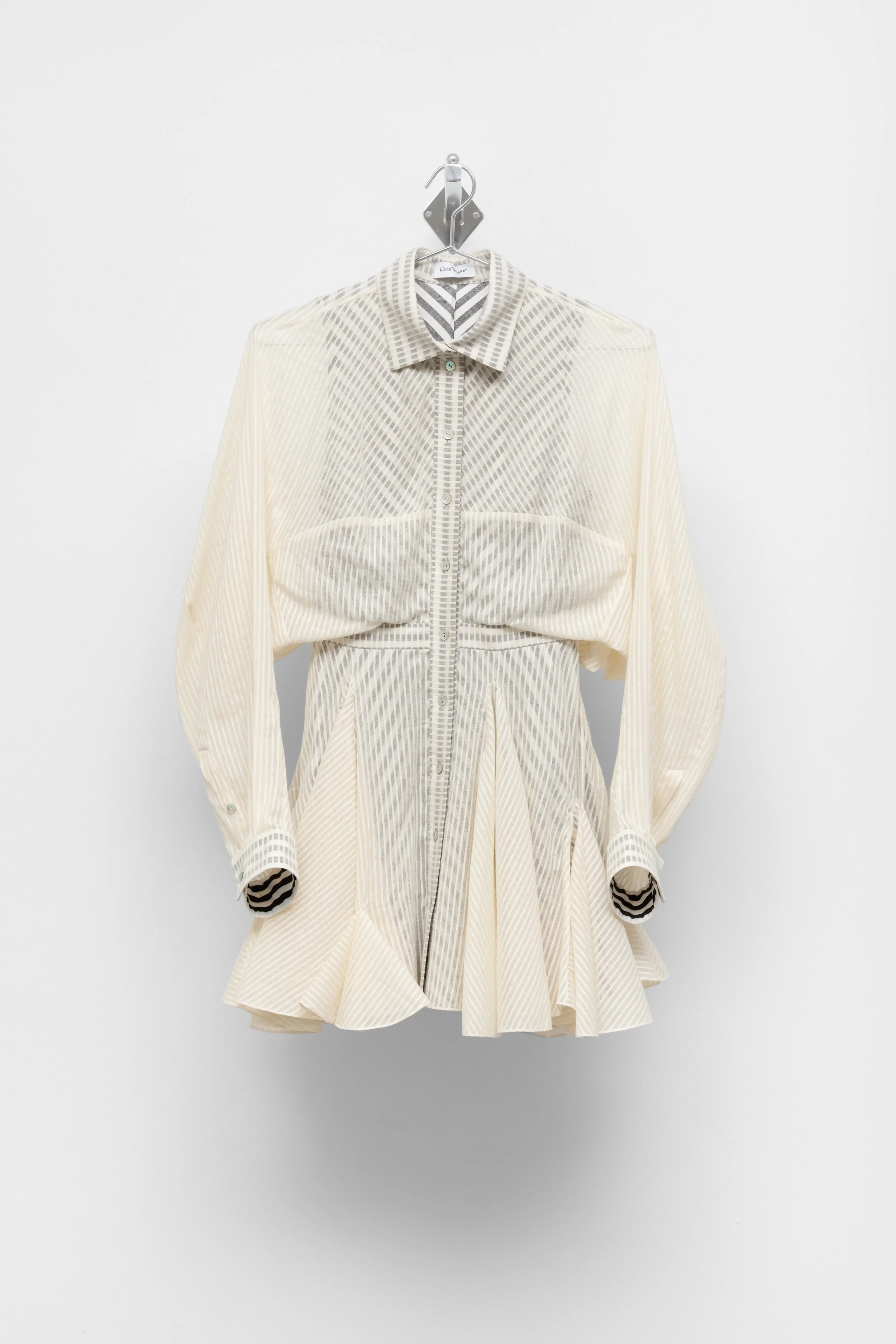 garment (flared mini shirt-dress)
2026
Cotton voile & stripe cotton dress on metal hanger and wall mount
27 x 40 x 12.5 inches
68.58 x 101.6 x 31.75 cm
PN E7
