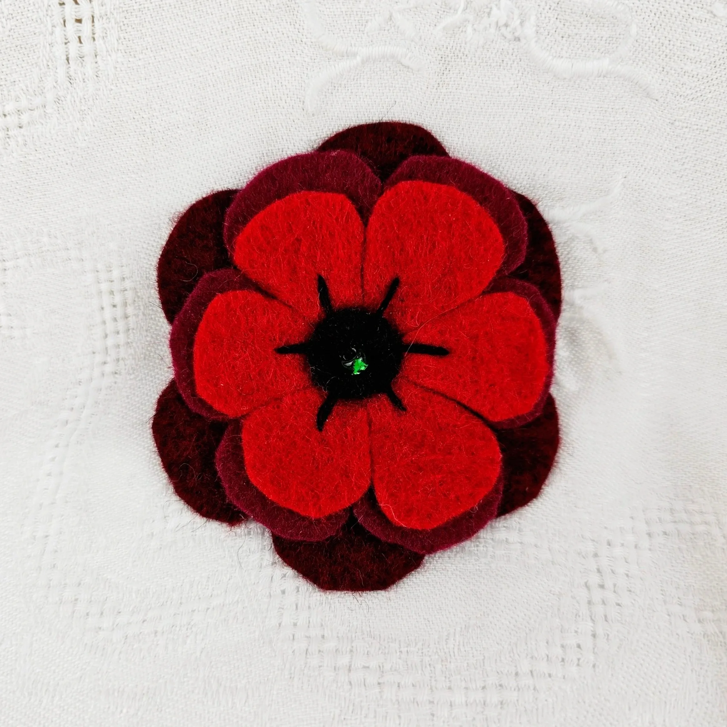 ANZAC Day poppy brooch pin flower memorial decoration decorations where to buy commission felt work Sara Meade Design Sarah NZ Artist Small Business Kiwi Aotearoa New Zealand