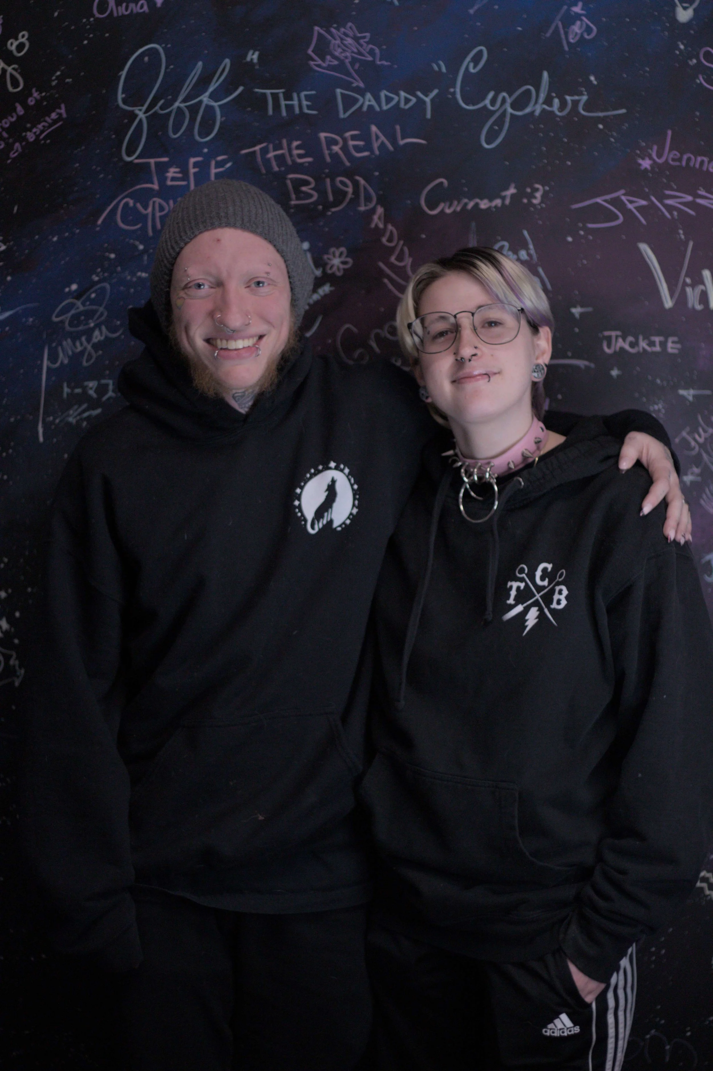 Aron and Julian posing in front of the signature wall!