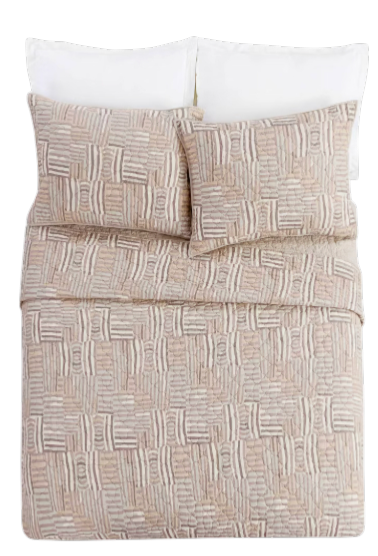 Abrazo Quilt - Bed with patterned beige comforter and white pillows