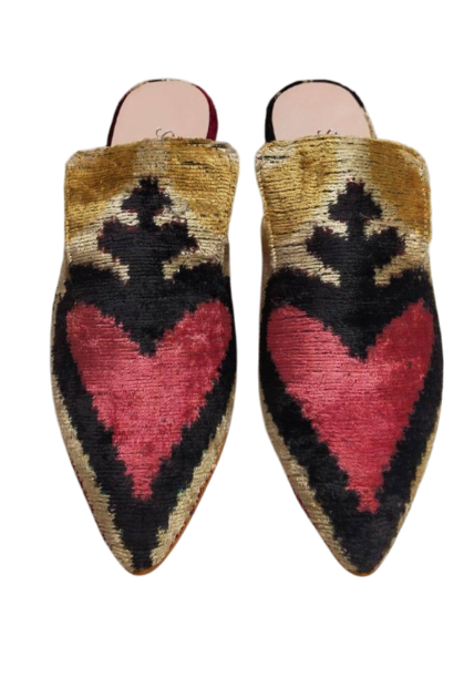 Pointed-toe slippers with a geometric pattern featuring a large red heart shape on the front, and black, beige, and brown colors.