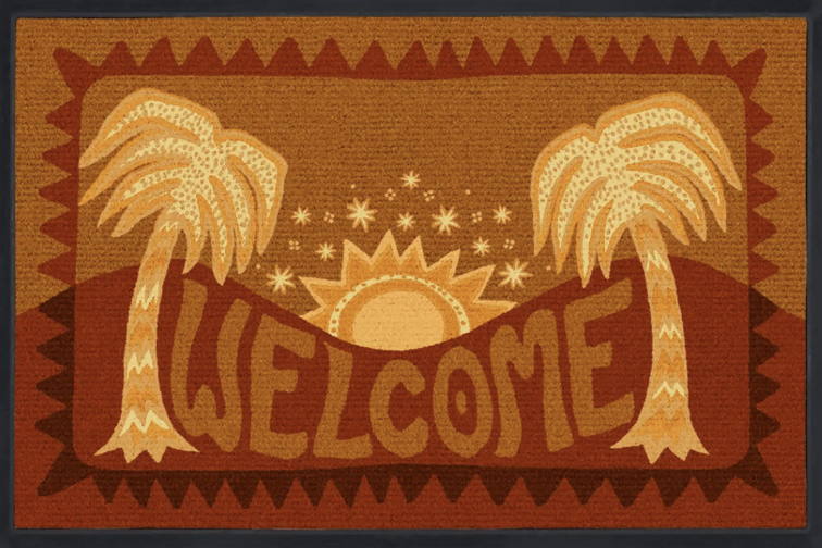 You'll always get a warm welcome with our Justina Blakeney Mystic Palms Doormat. Inspired by Justina's personal drawings, this bohemian and friendly design features a sunset layout framed by mirrored palm trees encircling the inviting "Welcome" sign.