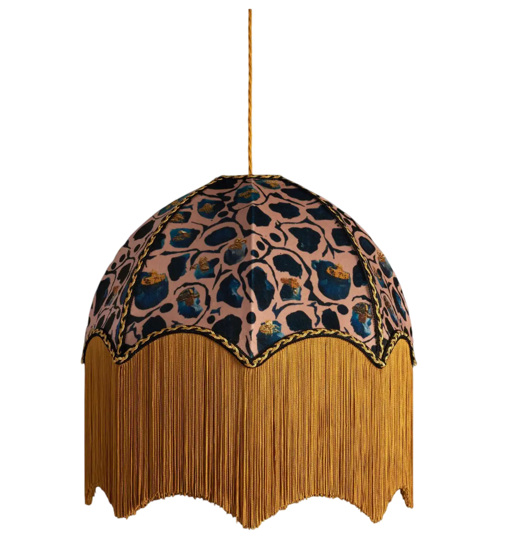 Giraffe is our fun animal print created from an ink painting. Anna added gold touches to deep inky blue tones, setting them on a blush pink background.

Anna Hayman lampshades create a fantastic centrepiece to a room and work as well on a lamp base a