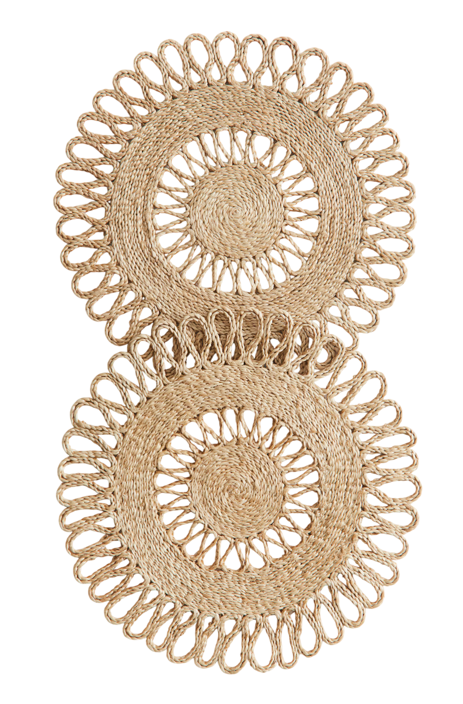 Round, hole-patterned placemats in braided jute.
