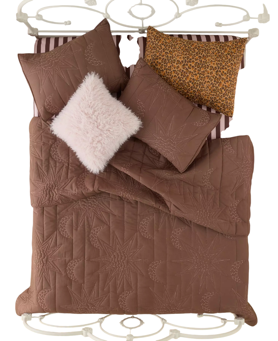 Embrace celestial vibes with this UO exclusive bedding set by Jungalow and Justina Blakeney, featuring quilted stitching creating intricate sun and moon motifs allover. Includes a sun and moon quilt and two shams with split-opening backs. Available e