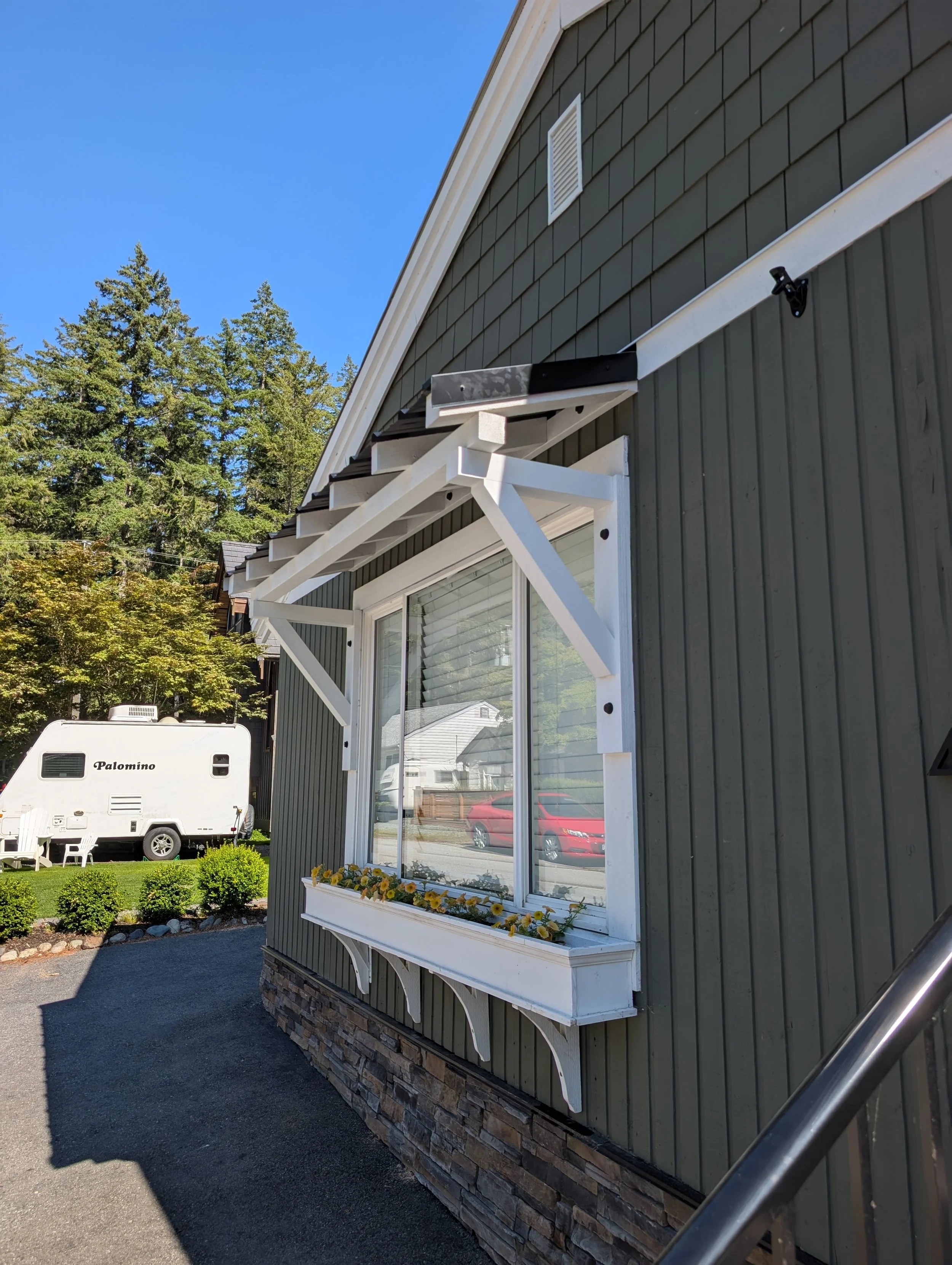 Custom white awning with black accents