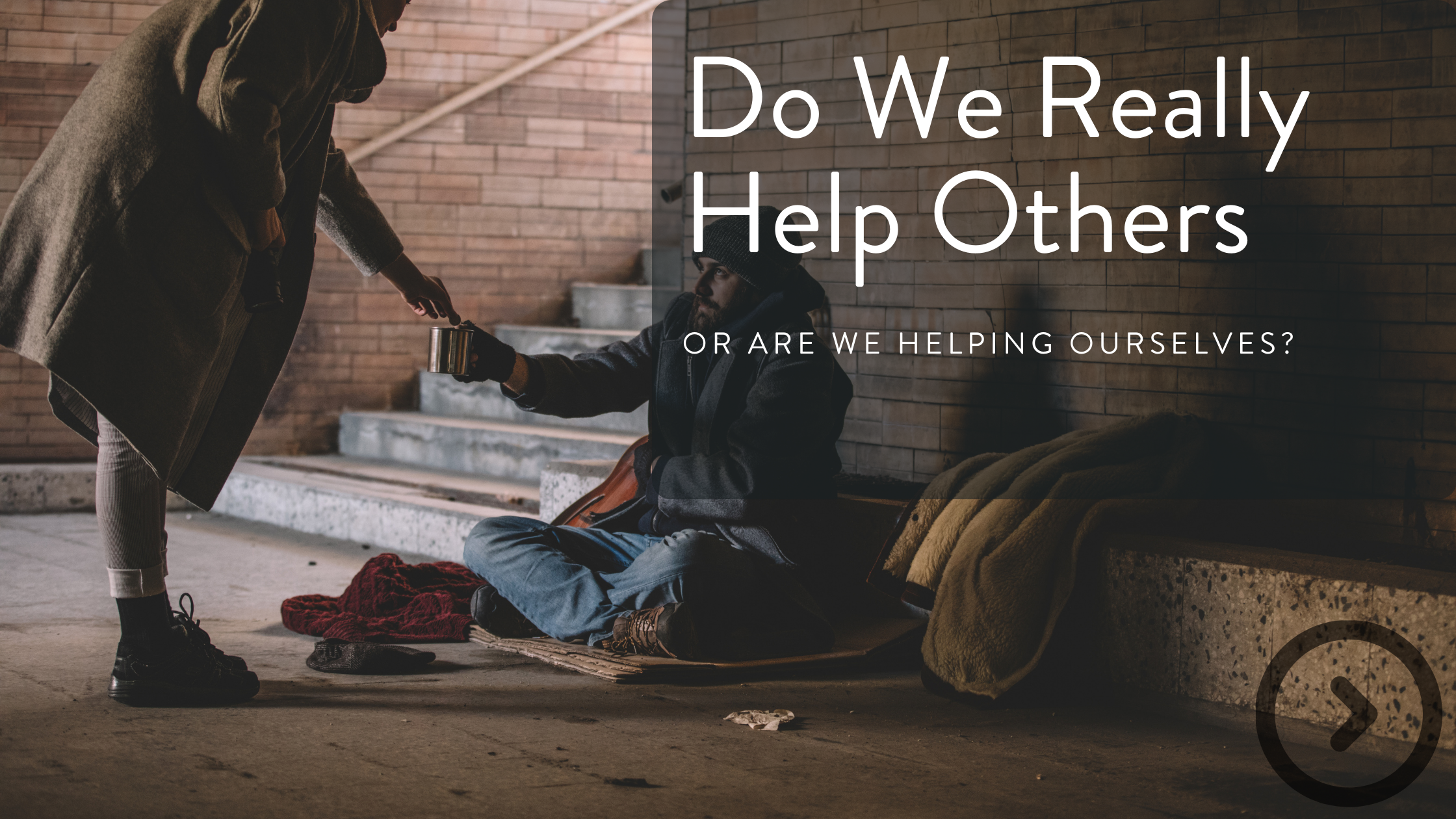 A person offers a cup to a homeless man sitting on a cardboard mat against a brick wall, with a blanket and bag nearby, in an urban setting, with overlay text asking 'Do We Really Help Others or Are We Helping Ourselves?'