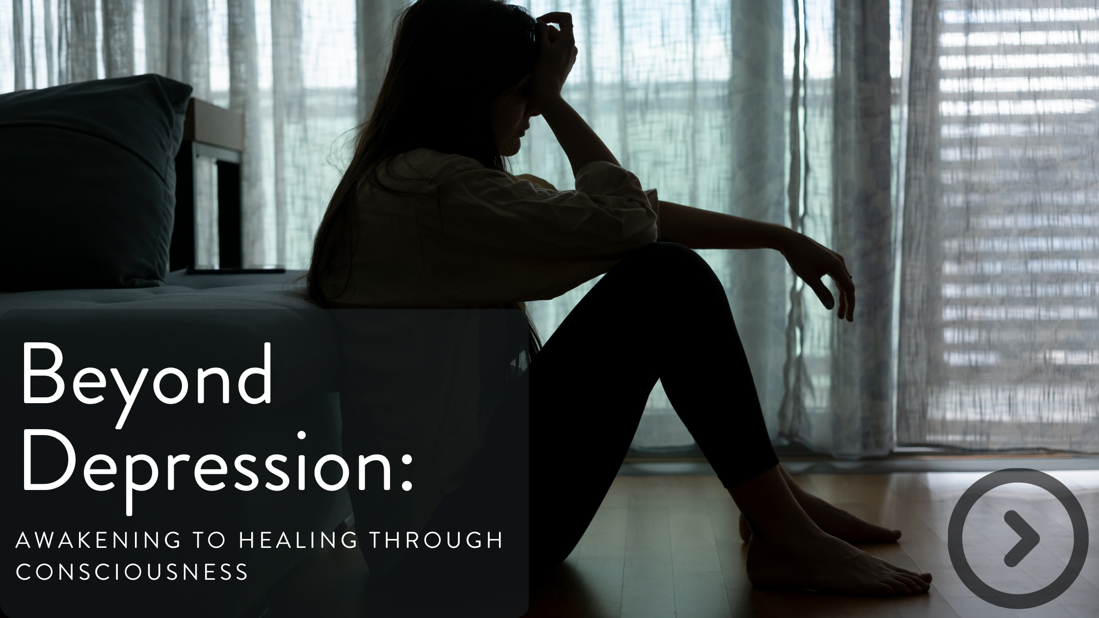 A silhouette of a woman sitting on the floor by a bed, with her head resting in her hand, near sheer curtains and a sliding glass door, conveying a contemplative mood.
