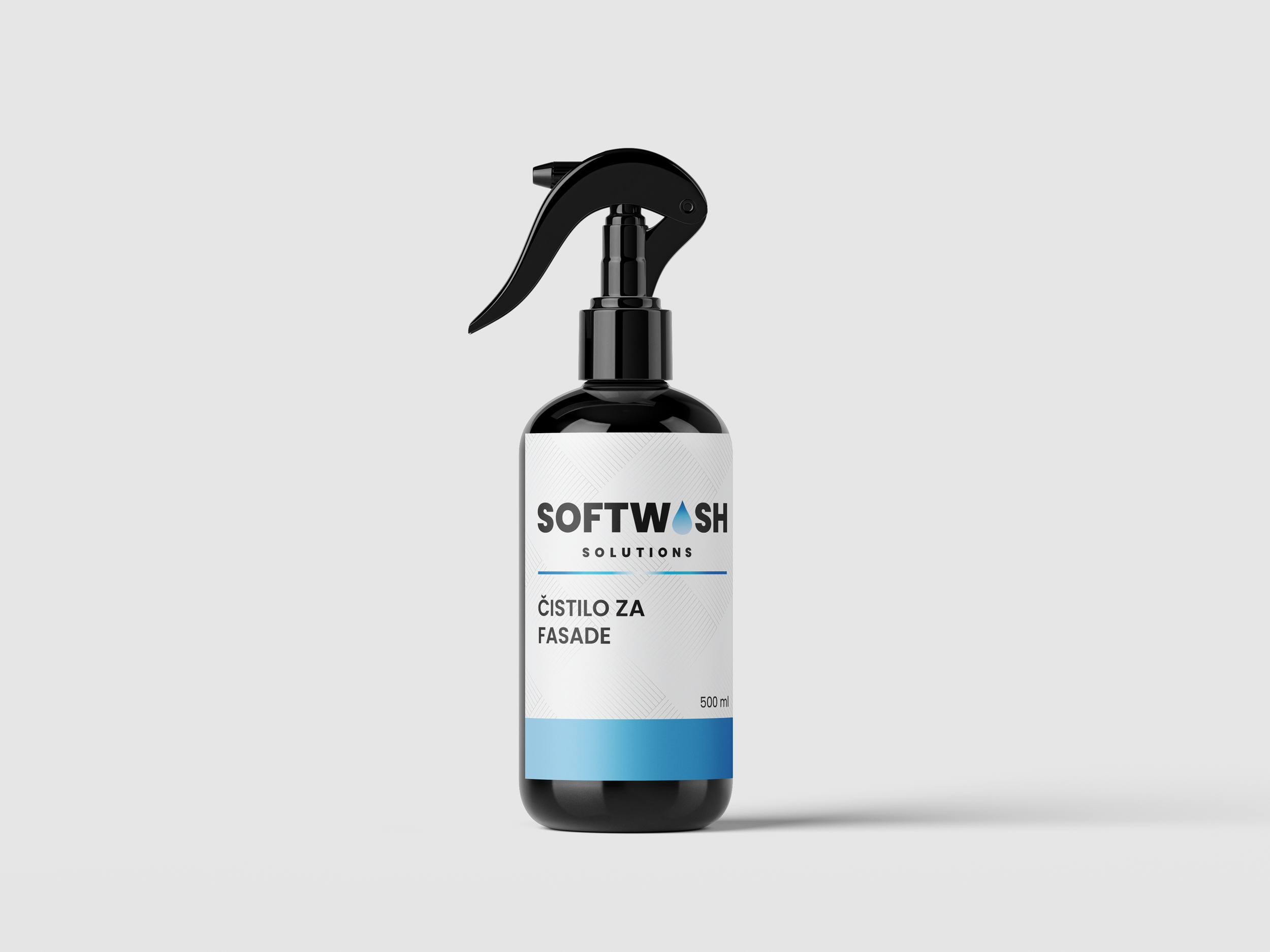Black spray bottle labeled 'SoftWash Solutions' with a blue stripe at the bottom and text in a foreign language, set against a light gray background.