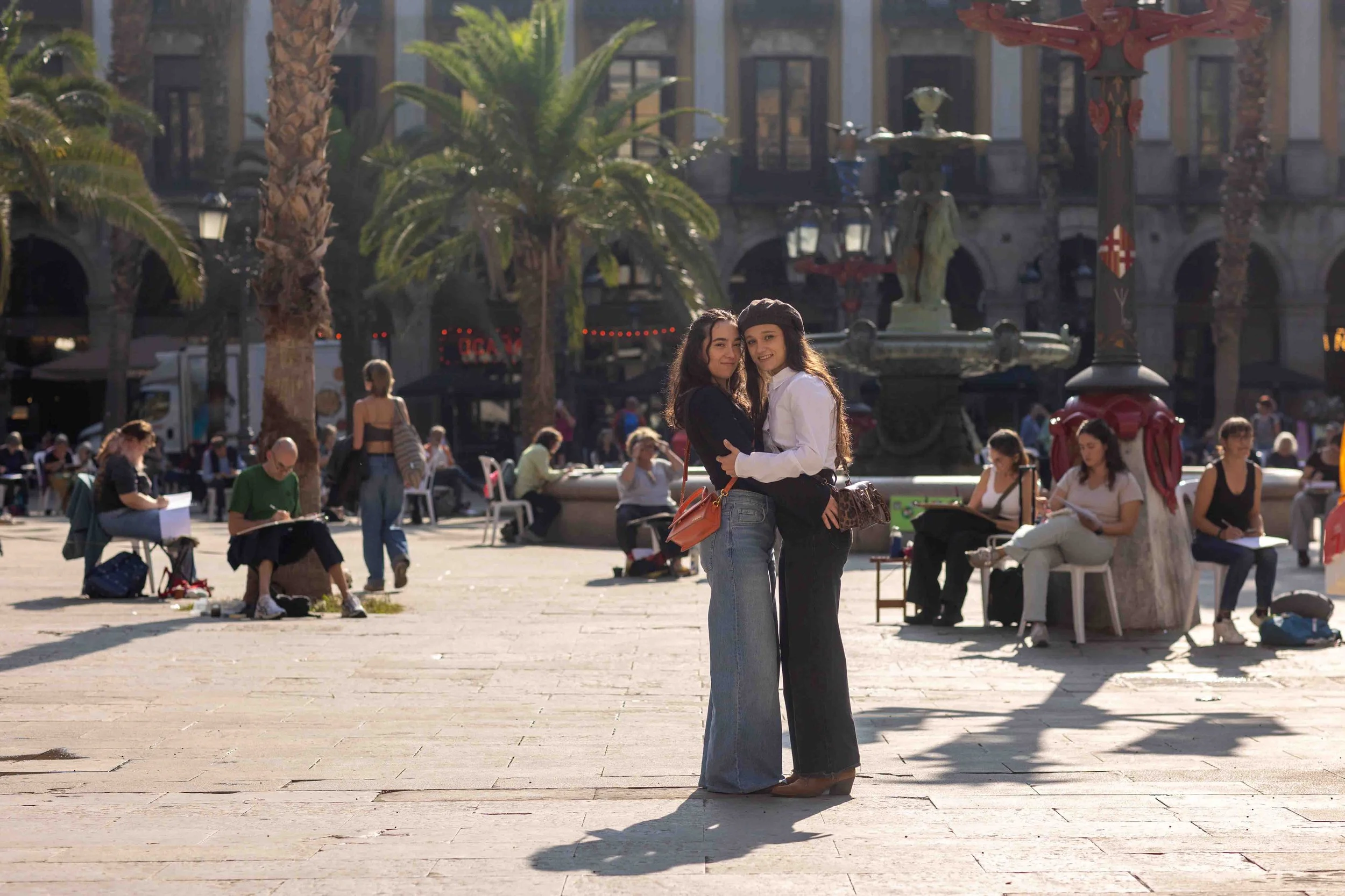 Destination wedding photographer in Spain capturing a romantic moment between two women during a couples photoshoot in Barcelona’s Gothic Quarter.
