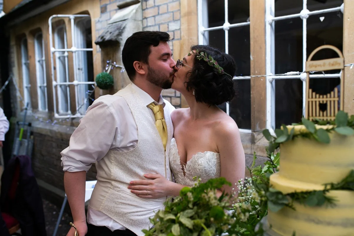Candid moment of bride laughing with bridesmaids getting ready