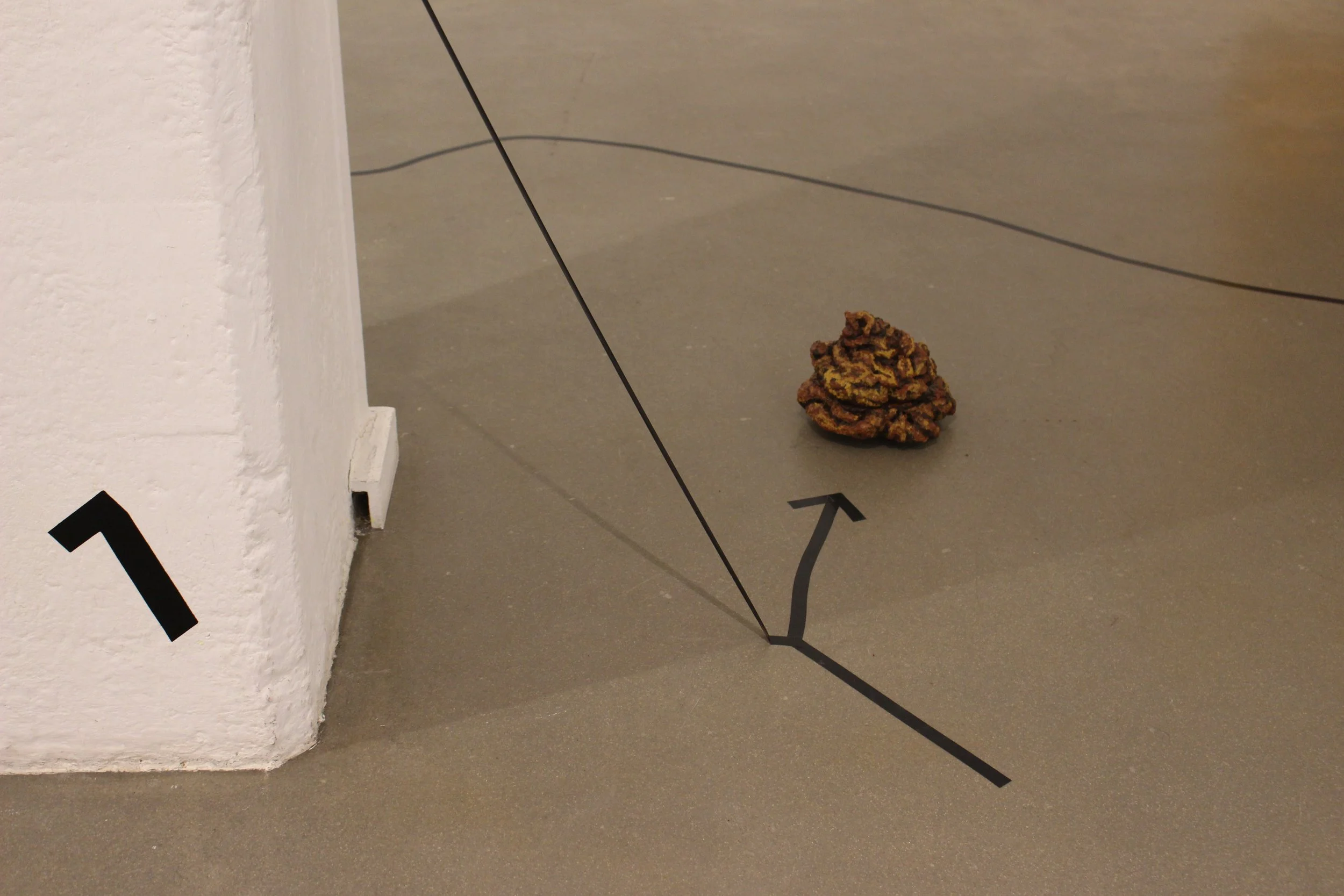 Nomad, 2023. Expanding foam, AGV robot, acrylic paint, tape, acrylic numbers — Variable dimensions