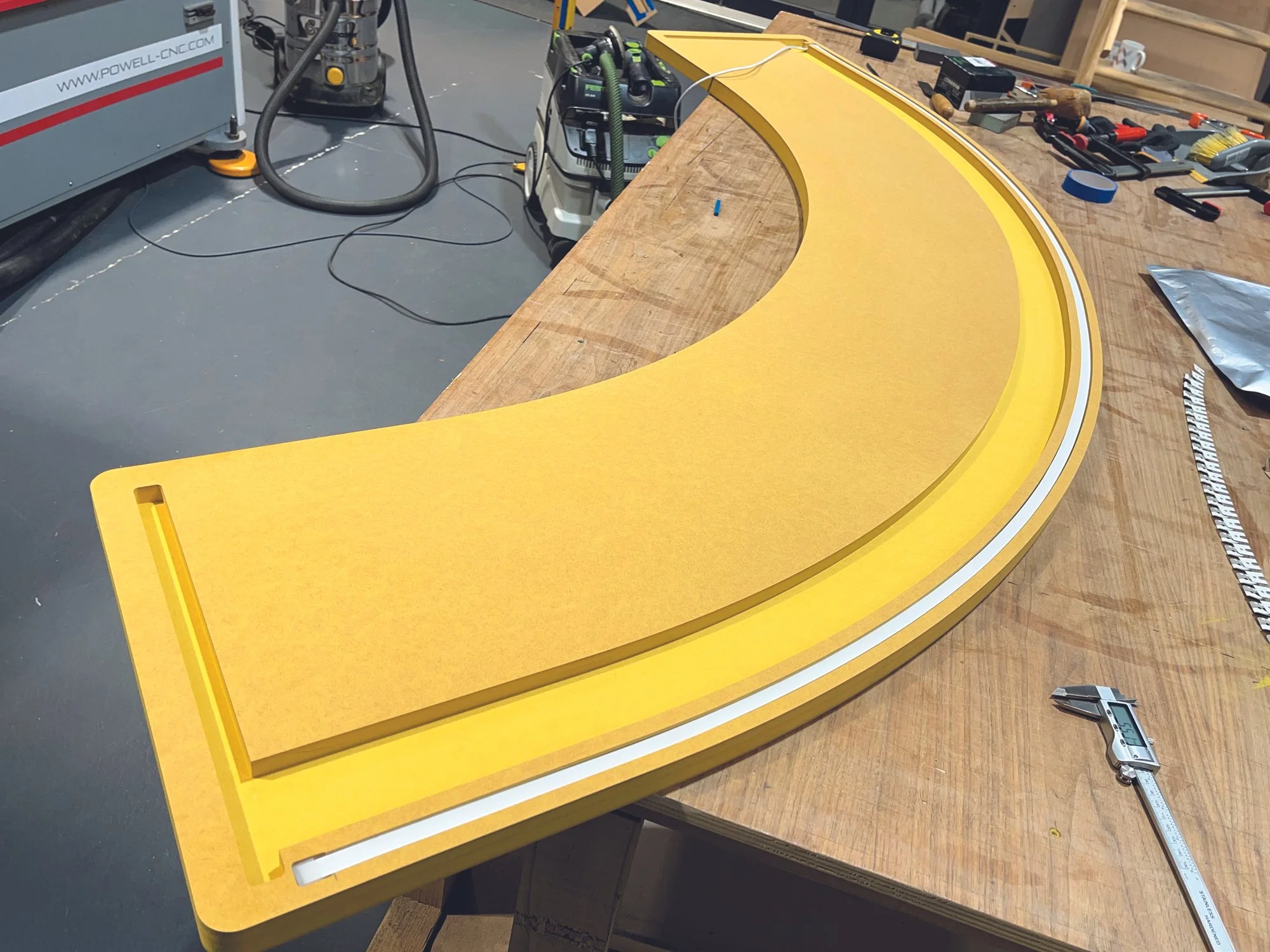 Underside of curved reception desk with LED lighting.jpg