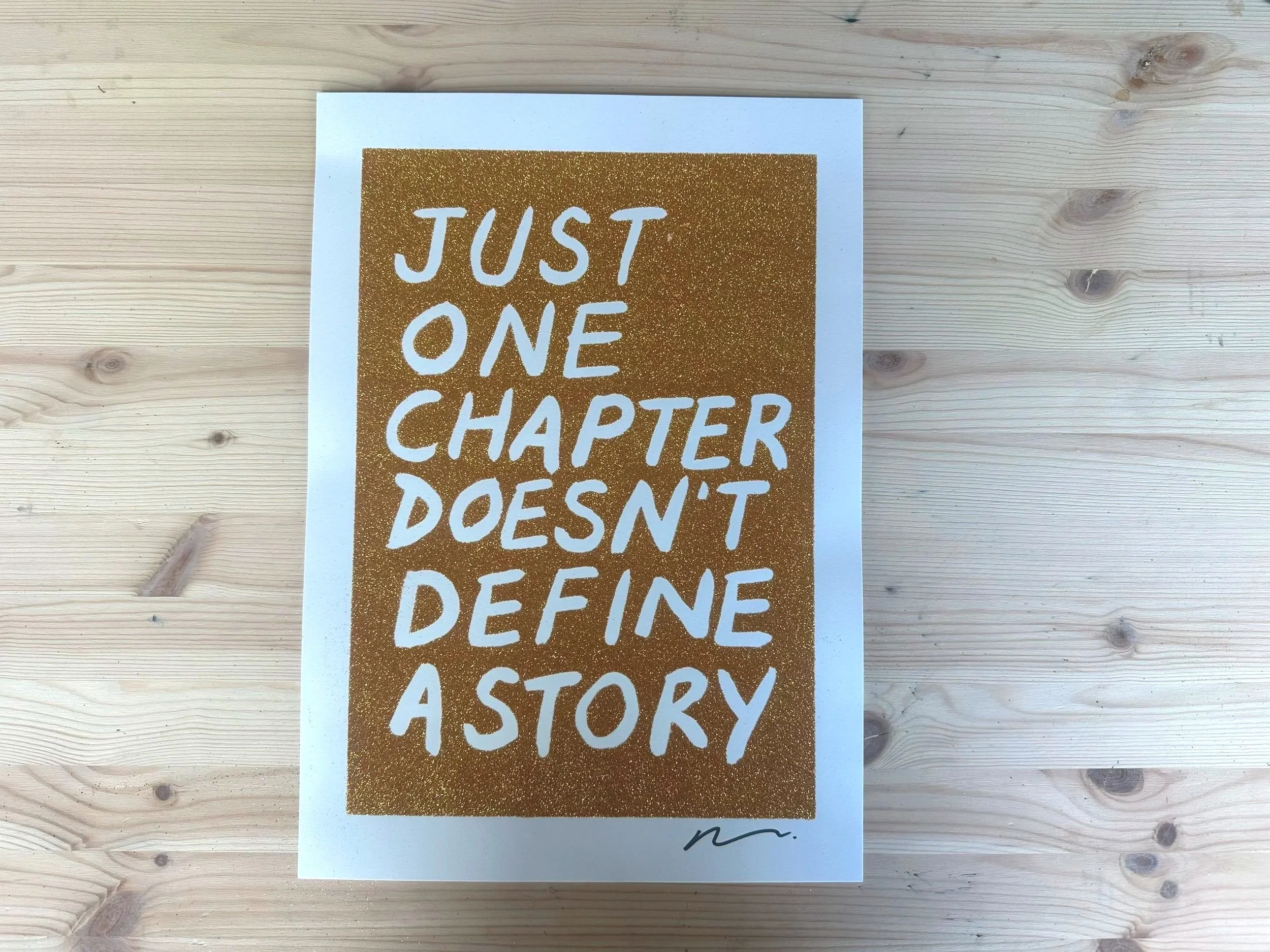Adam Bridgland Glitter Screenprint – Just One Chapter Doesn’t Define a Story (A3, Gold)