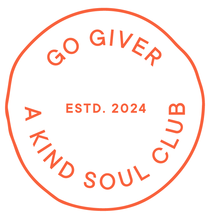 A circular logo with orange text reading 'Go Giver A Kind Soul Club Estd. 2024' on a black background.