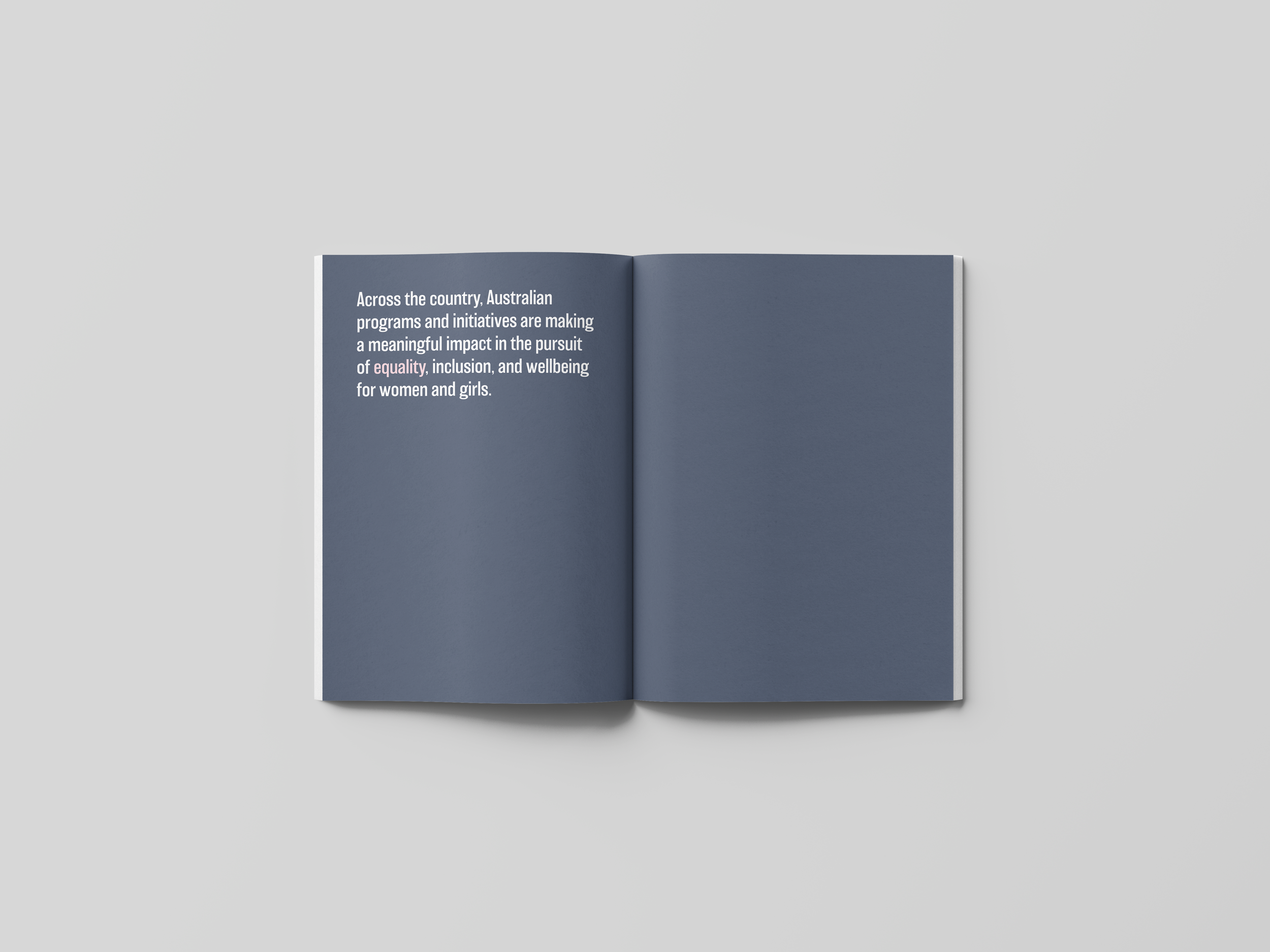 Open booklet with dark blue pages, white text on the left page discussing Australian programs for women's equality and wellbeing.