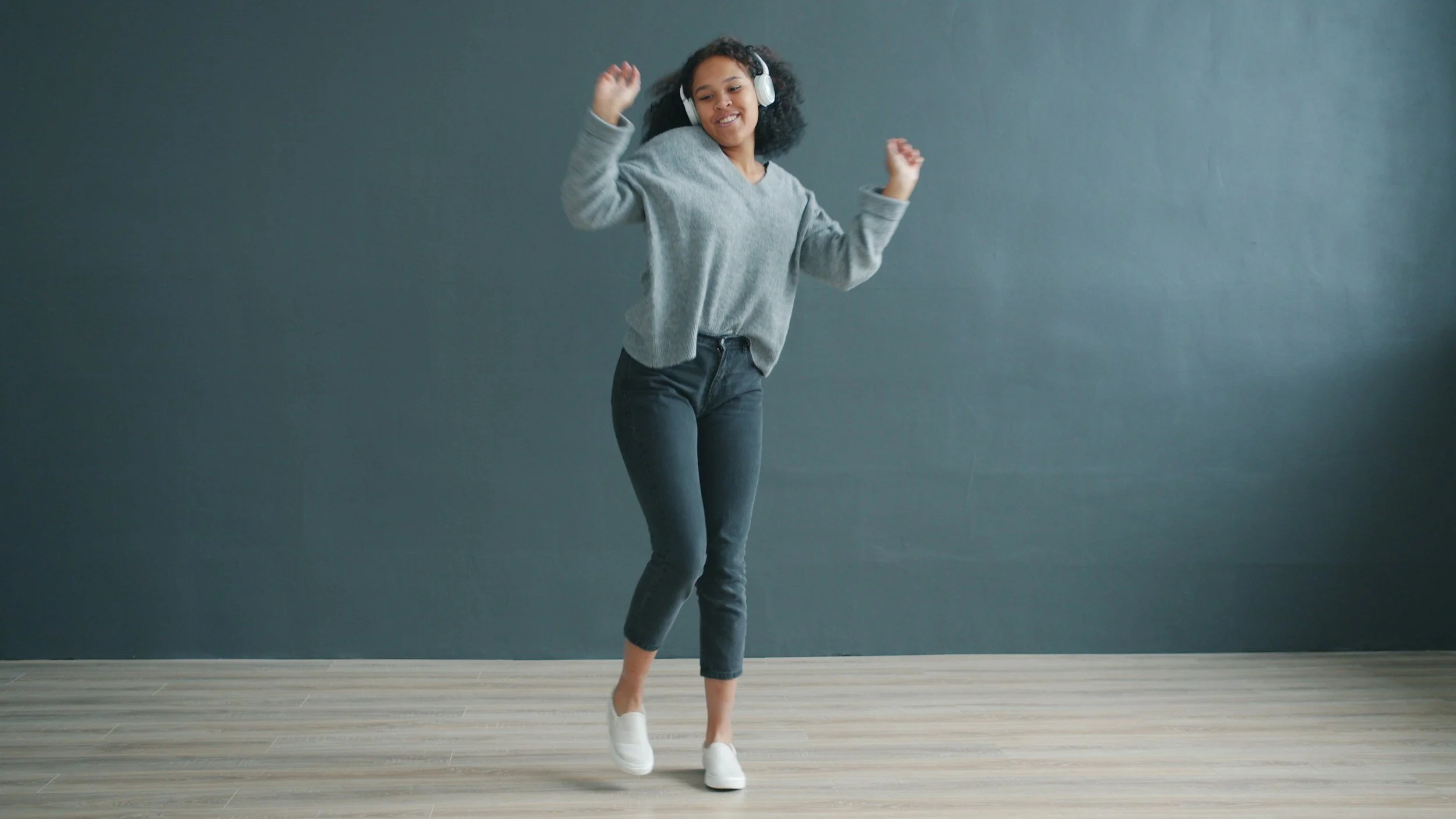 Woman listening to music and dancing