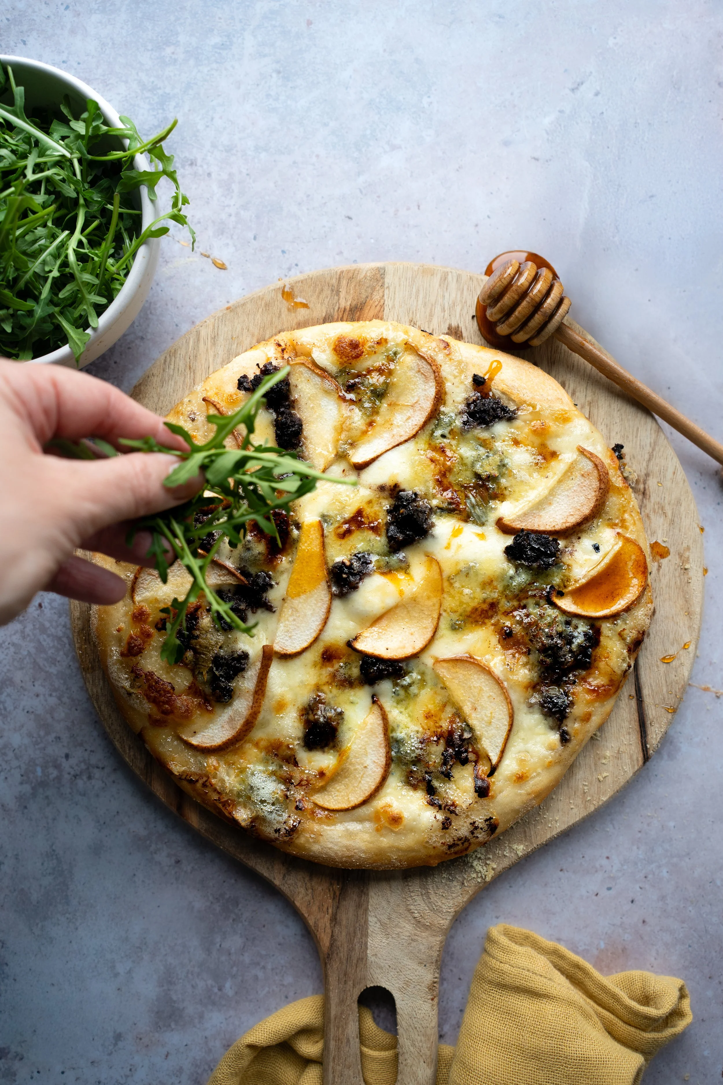 Cashel Blue Cheese , Pear and Black Pudding pizza with rocket. food styling and Photography by Loraine Cox Wicklow