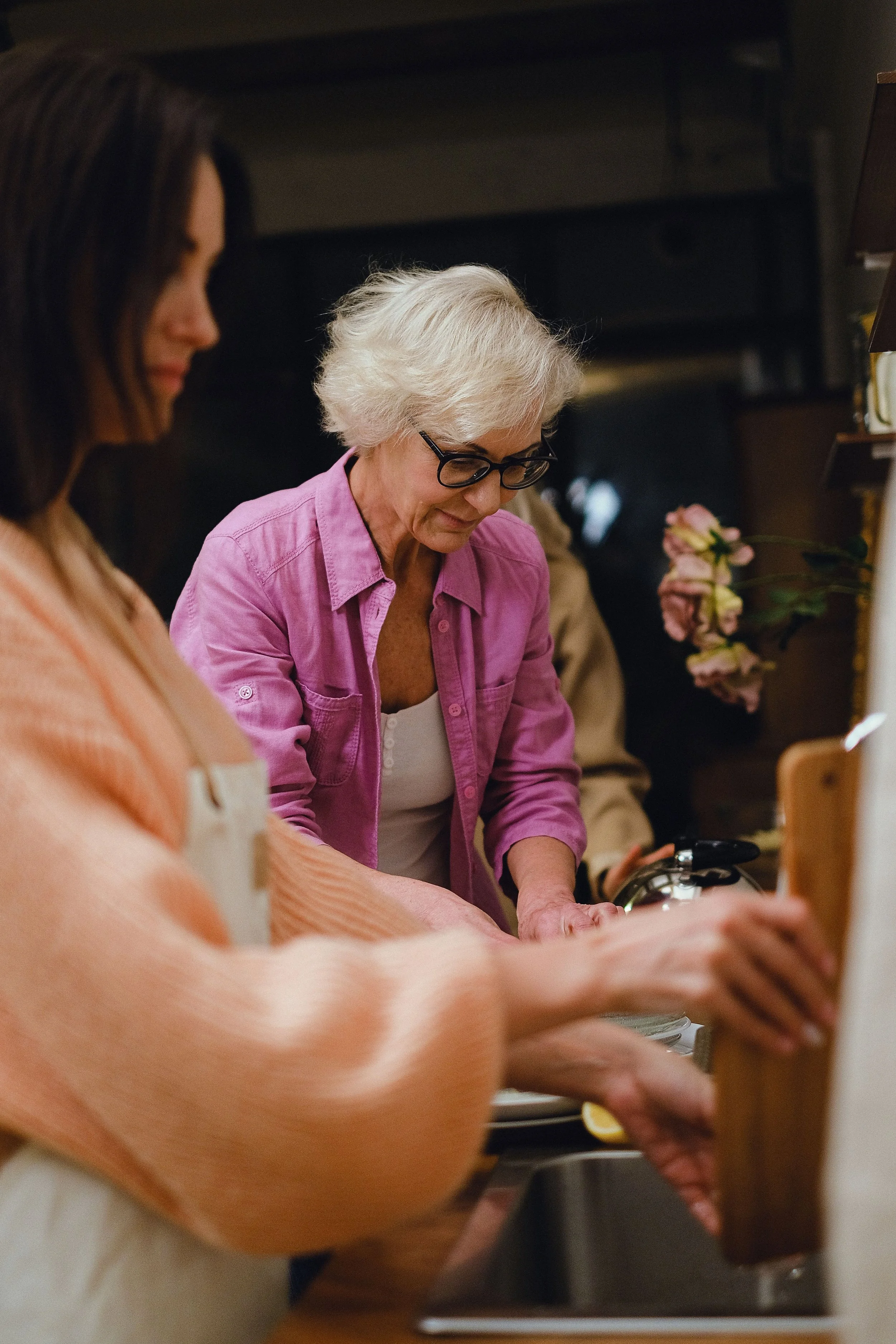 Two people washing up after a meal