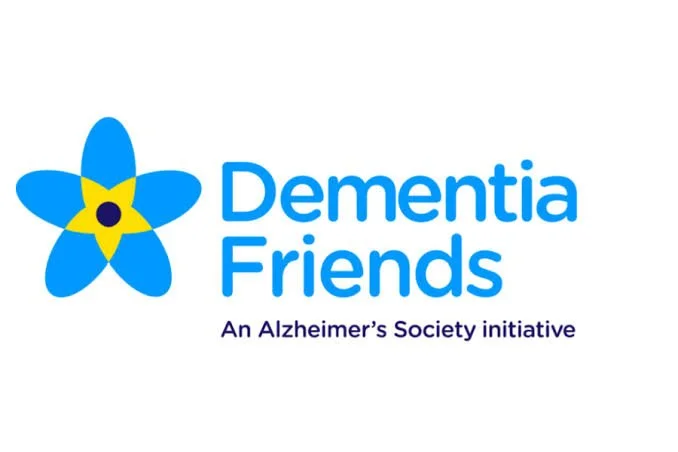 Logo for Dementia Friends, an Alzheimer's Society initiative, featuring a blue flower with yellow accents and text in blue and purple.