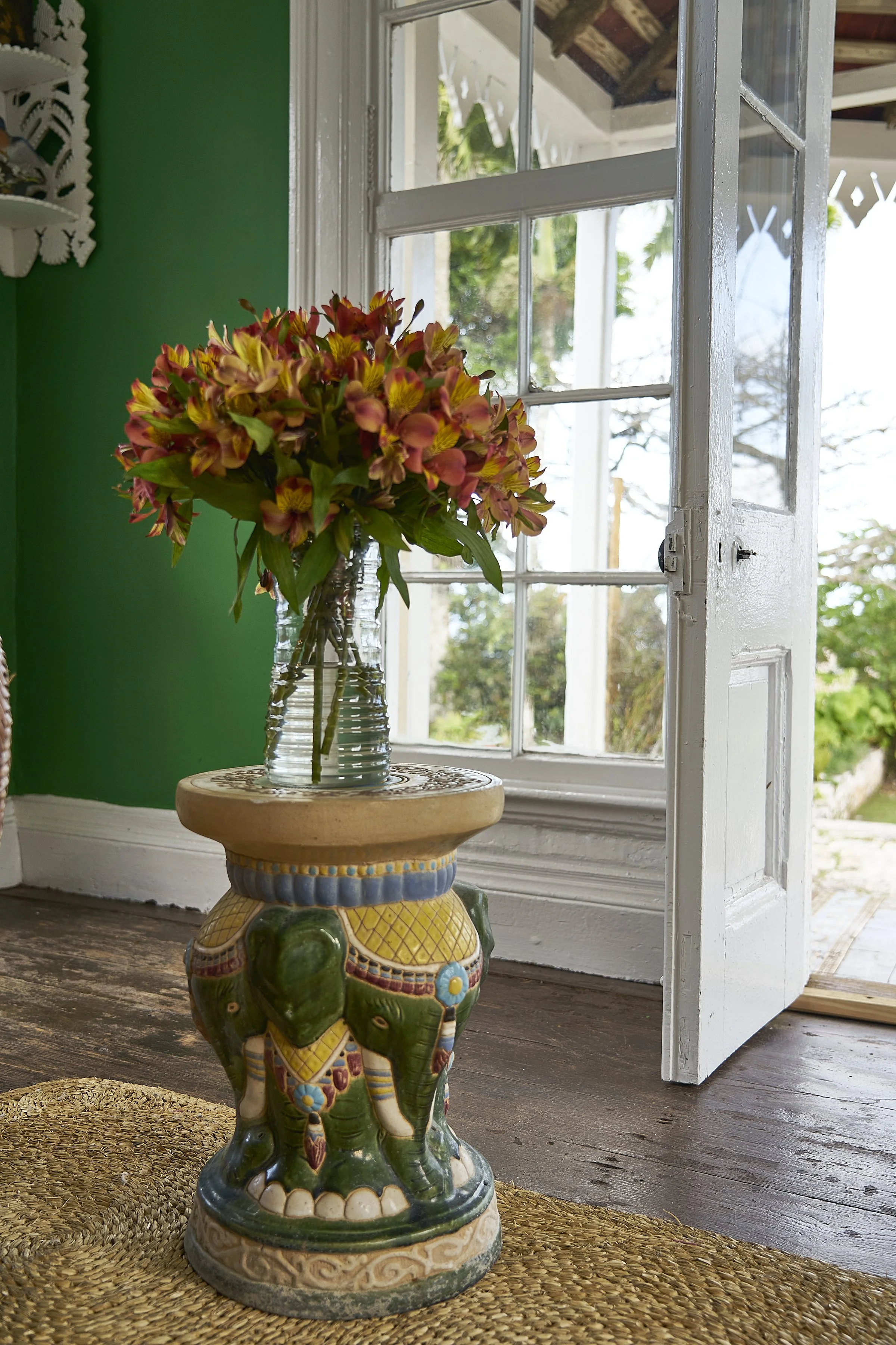 A bouquet of red and yellow flowers in a vase.