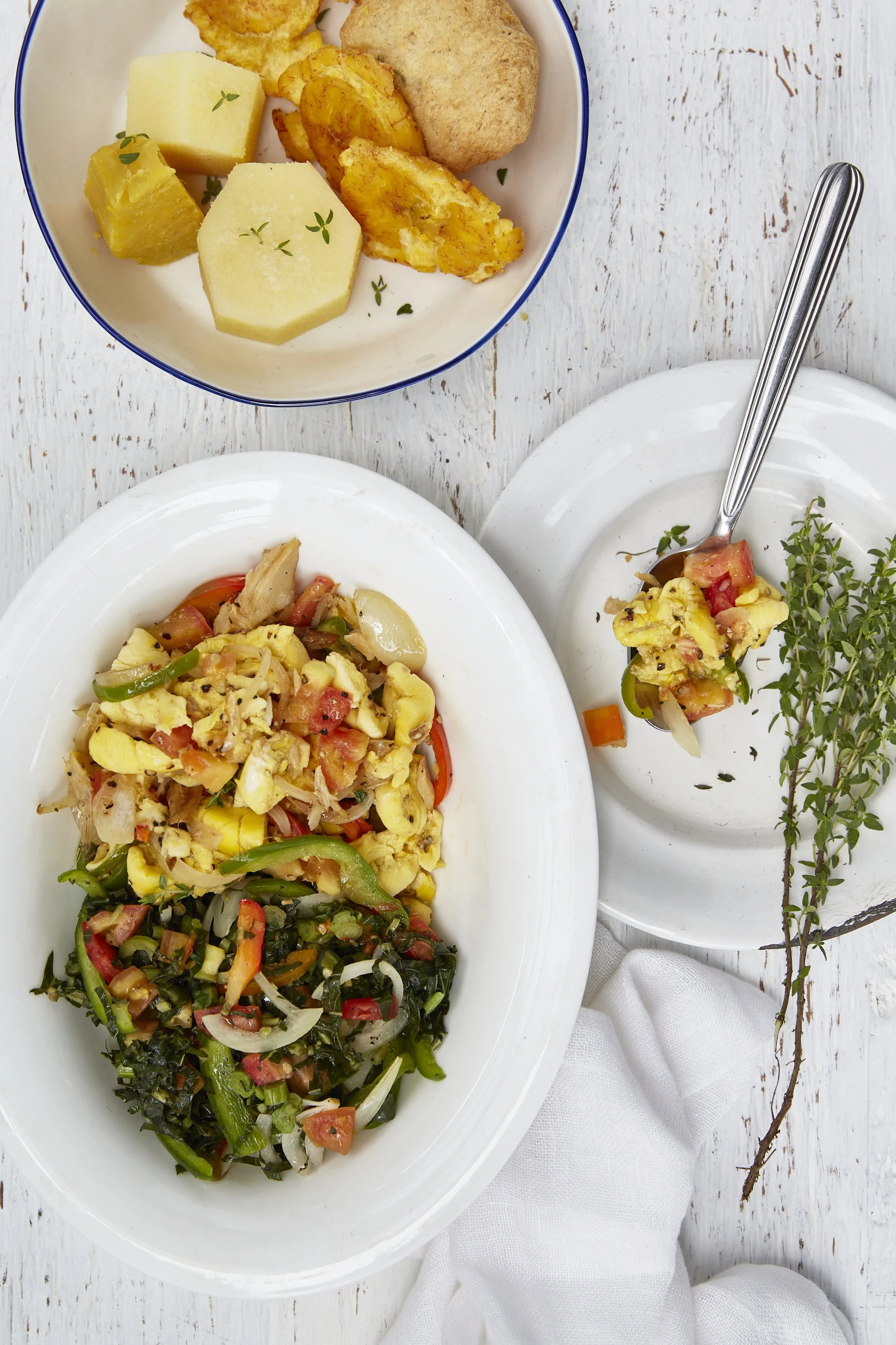 Sauteed vegetables and other ingredients on a white plate.