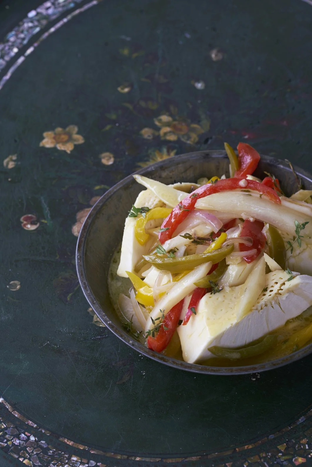 Vegetables in a dark bowl.