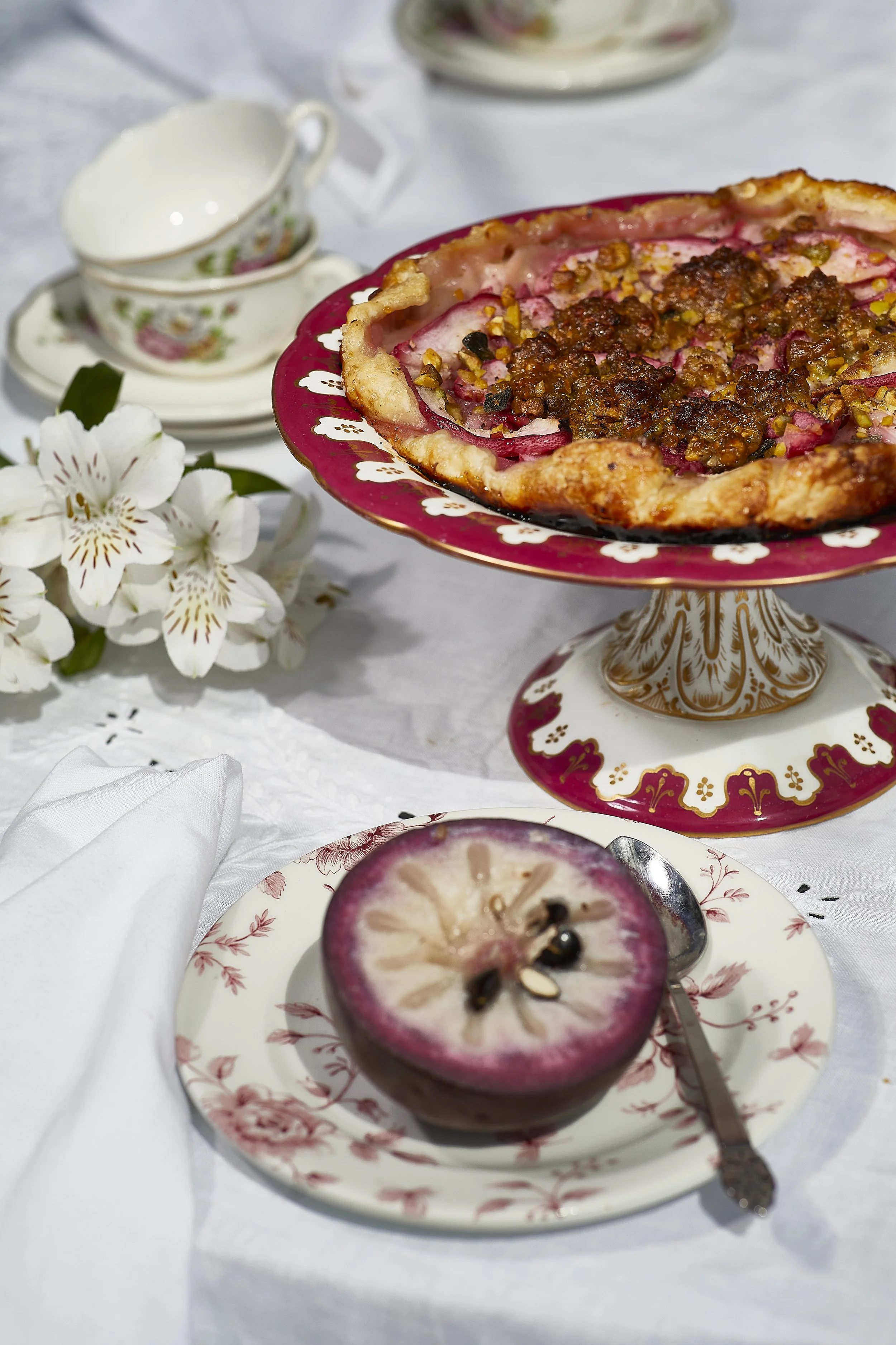 Floral plateware with food on top.