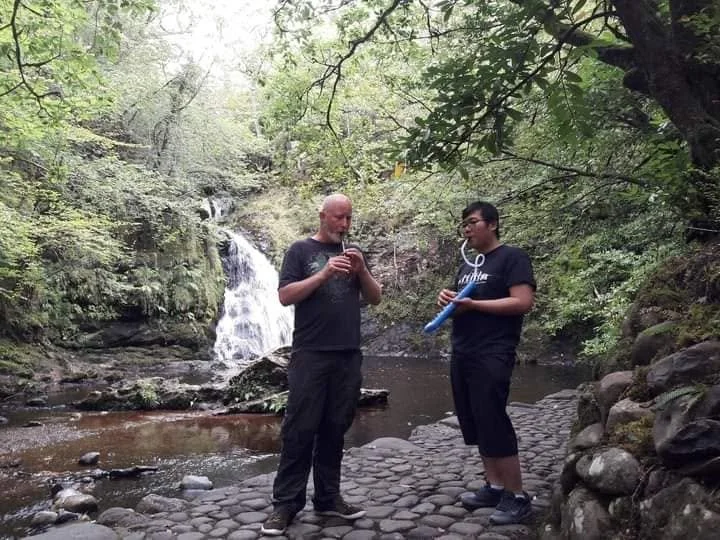 me and tai playing at a waterfall in ireland.jpg