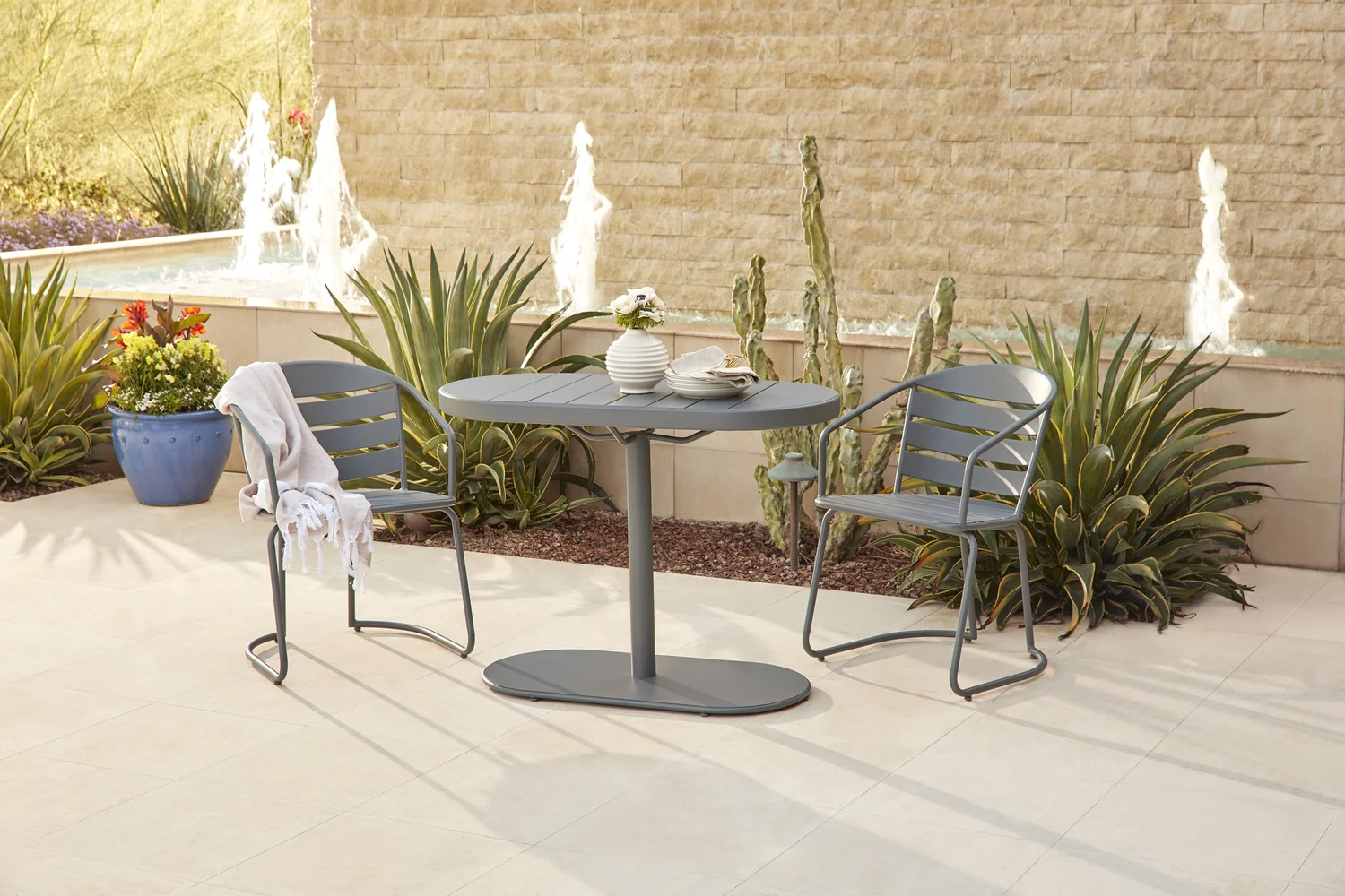 Outdoor patio table and chairs after ground retouching and cleanup