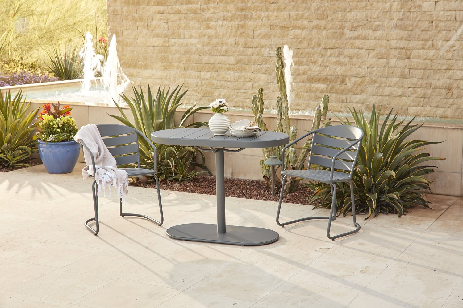 Outdoor patio table and chairs before ground retouching