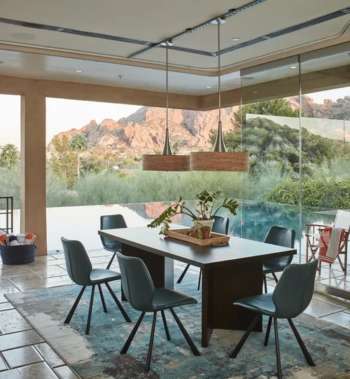 Dining room with exposed ceiling tracks before retouching