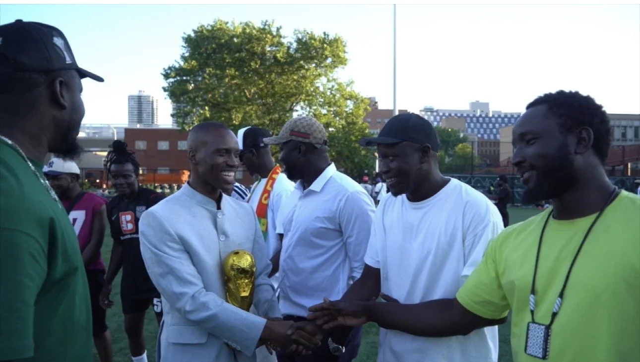 More than 600 street vendors asylum seekers honored, Amadou Ly, our founder with a recognition award during a soccer tournament, thanking the Amadou Ly Foundation for its work.