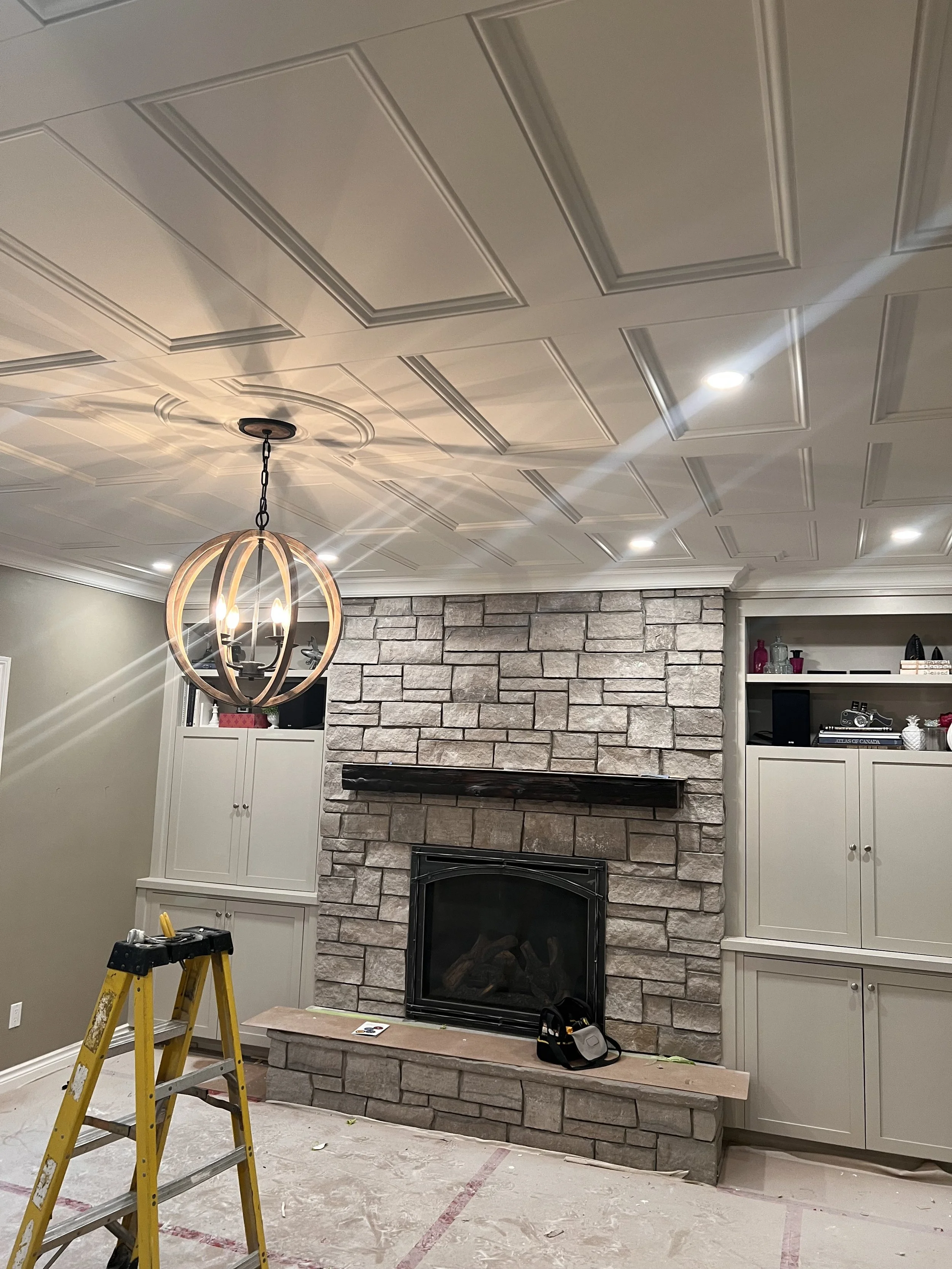 a stunning chandelier in a renovated living room.  