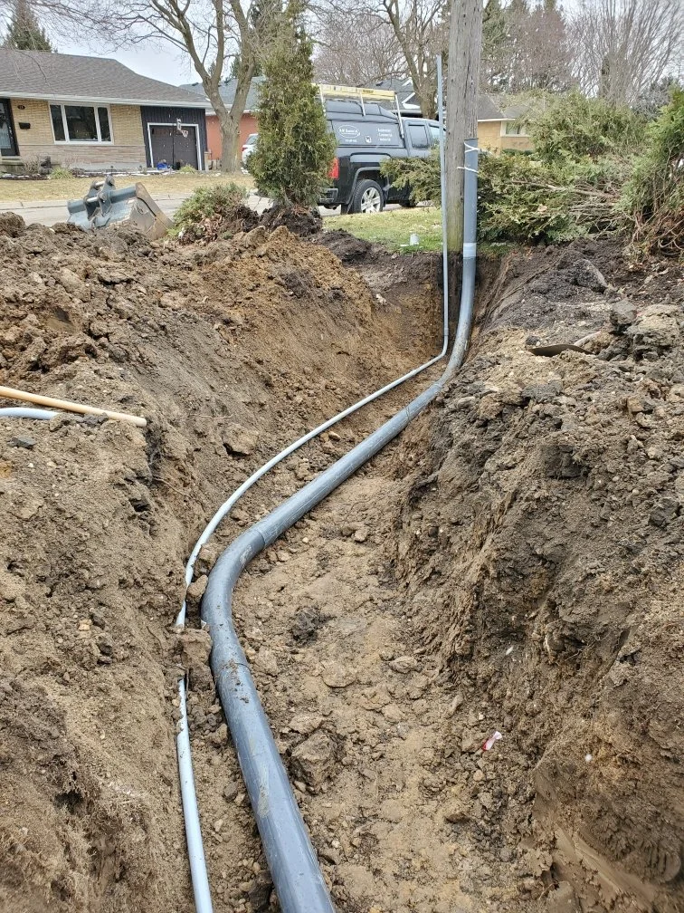 Inground wiring running from a hydro pole.