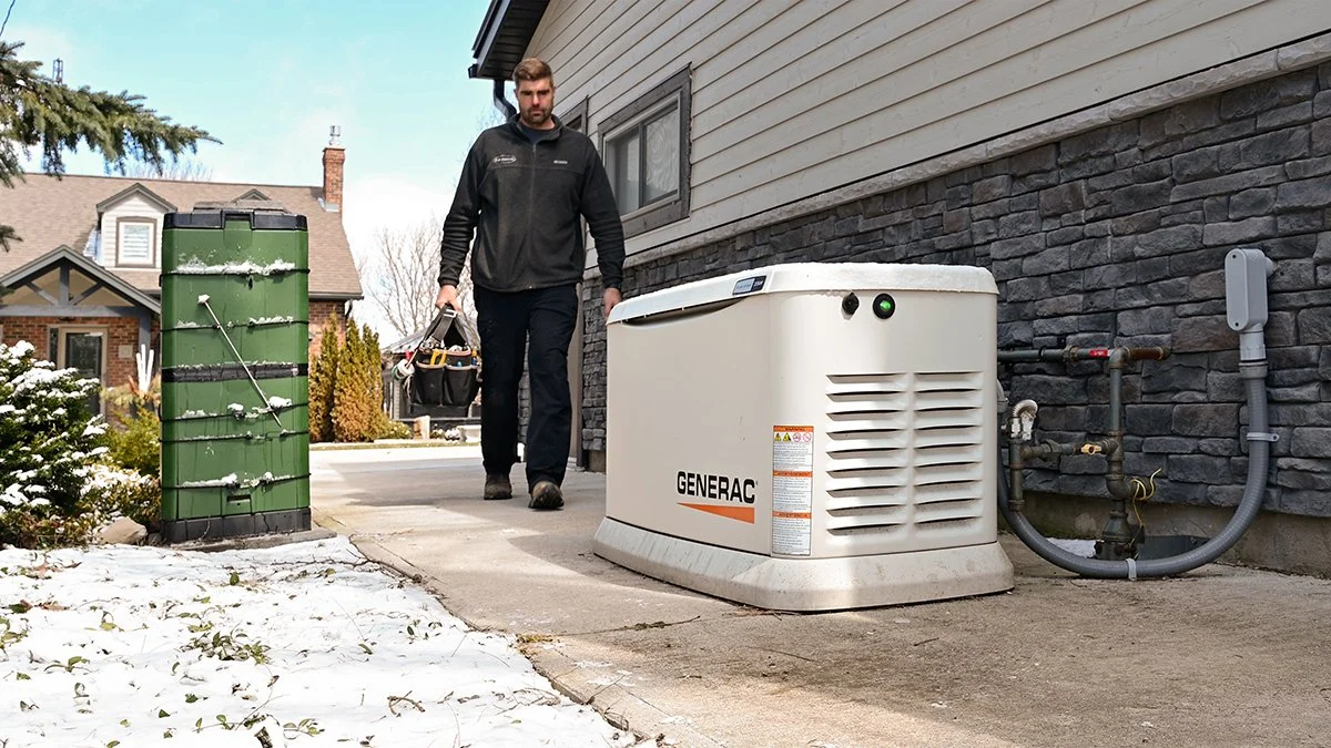 Electrician approaching a home standby generator.