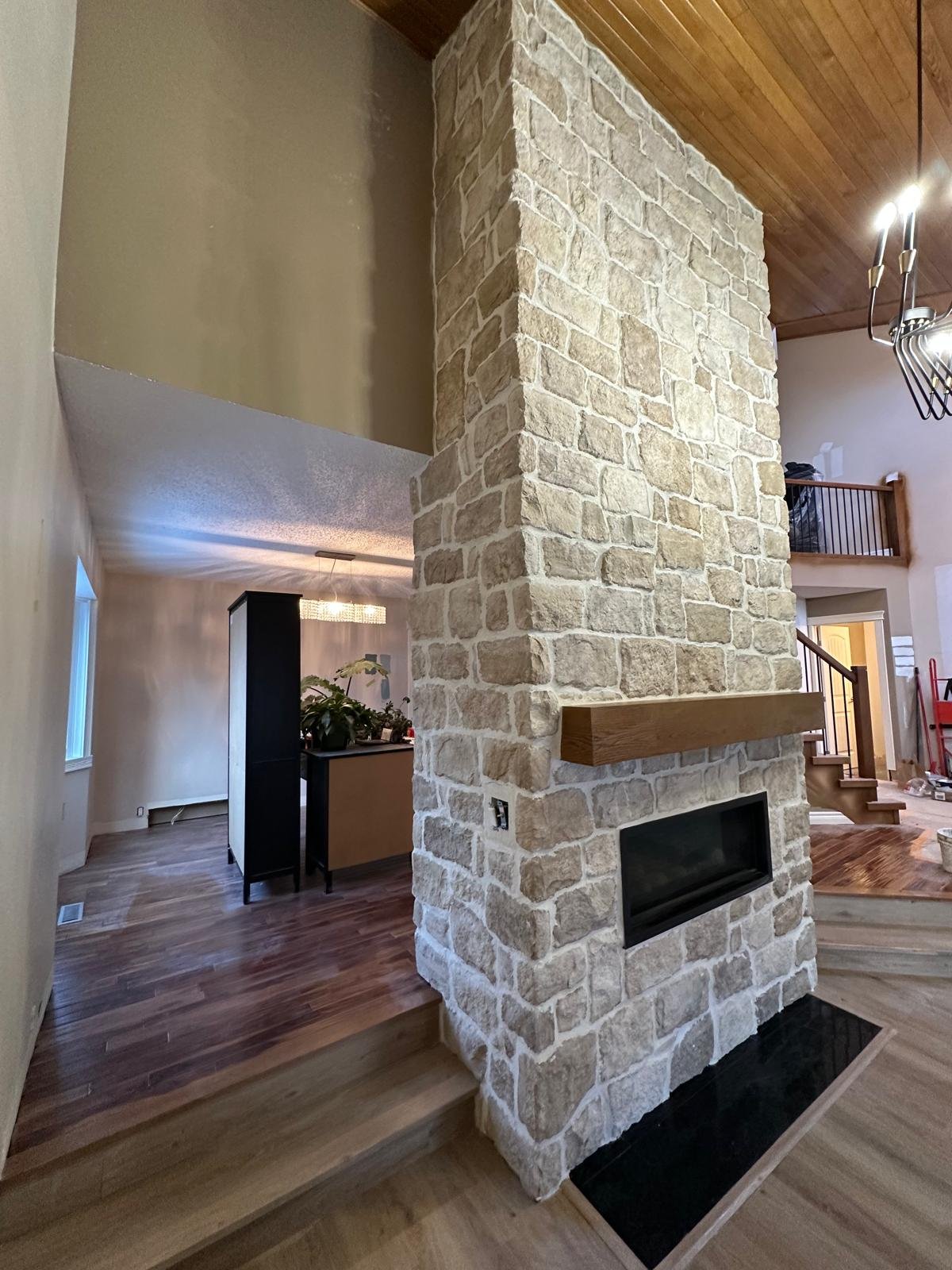 Pink marble tiles with black grout lines in a grid pattern.