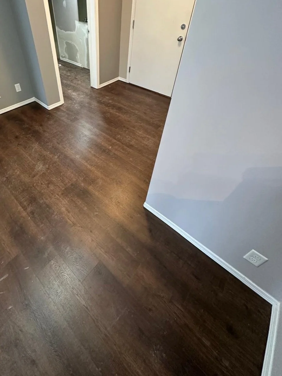 a geometric pattern of textured stone tiles in shades of gray and brown