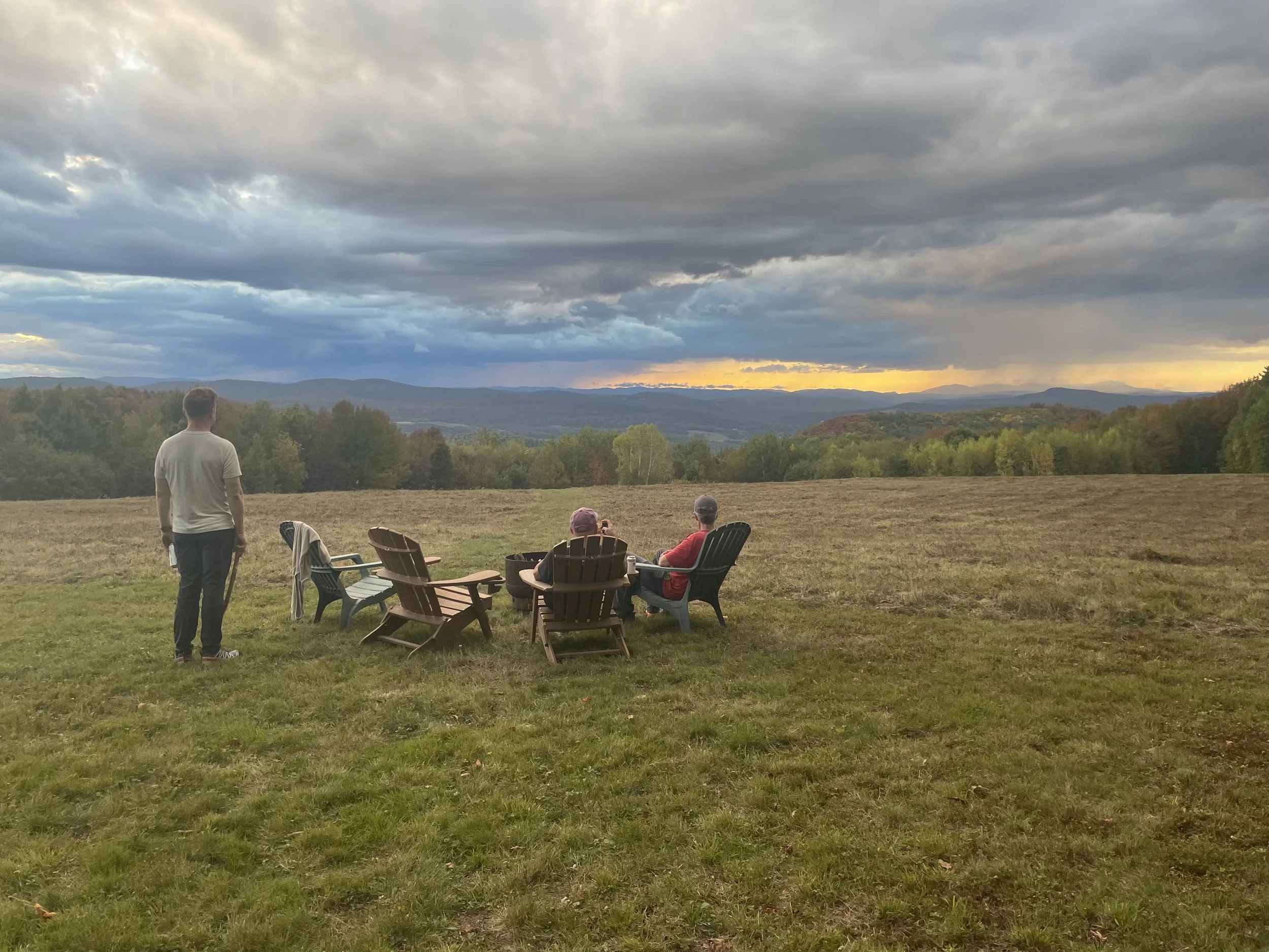 Men looking out on valley above Connecticut River and the White Mountains, New Hampshire