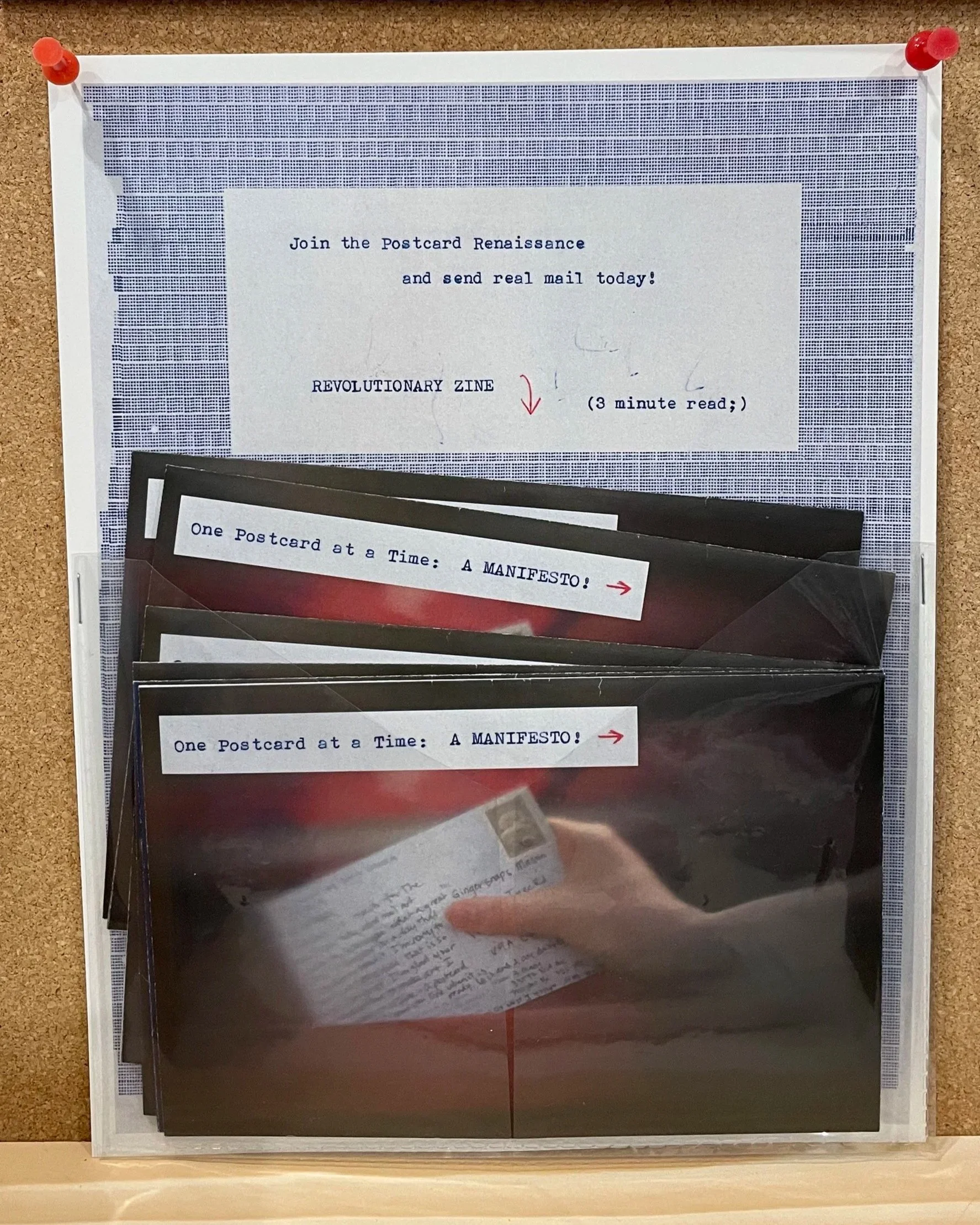 Poster with a pocket containing 6 zines. The poster is displayed on a bulletin board and says 'free' please take one.