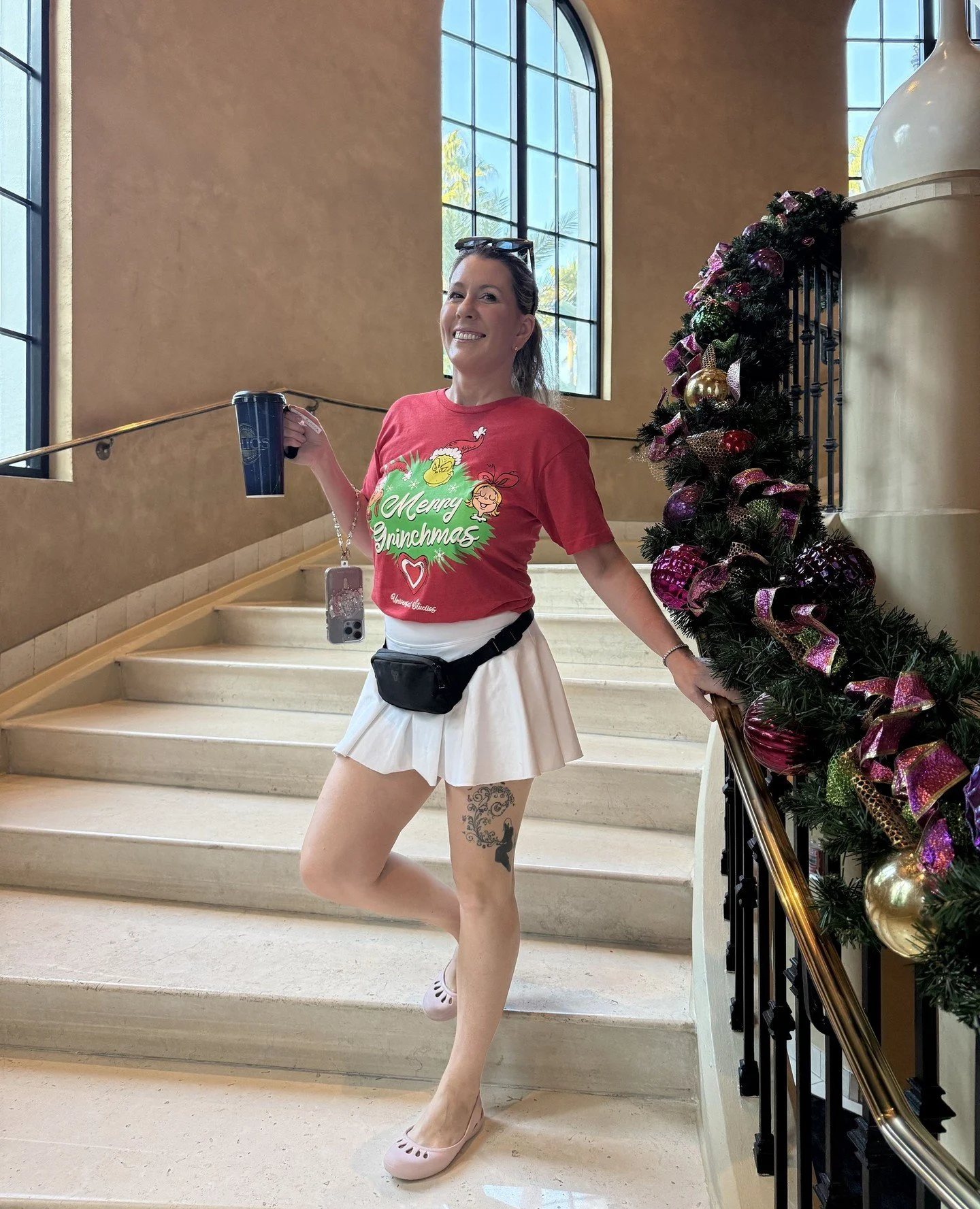 Feeling festive in my merry Grinchmas shirt as I soak in the holiday magic at Universal Orlando and Disney World! 🎄✨ ⁠
#disneyworld #orlandoflorida #thegrinch