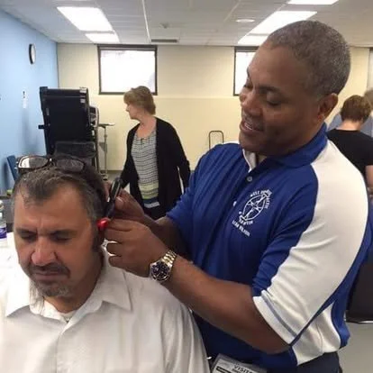 Dr. Michael Gerdine providing personalized chiropractic treatment to a patient at West End Chiropractic & Rehab Center in St. Louis.