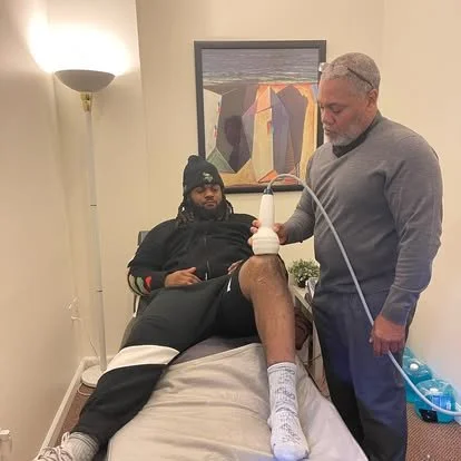 St. Louis chiropractor Dr. Gerdine performing hands-on care to help a patient improve mobility and reduce pain.