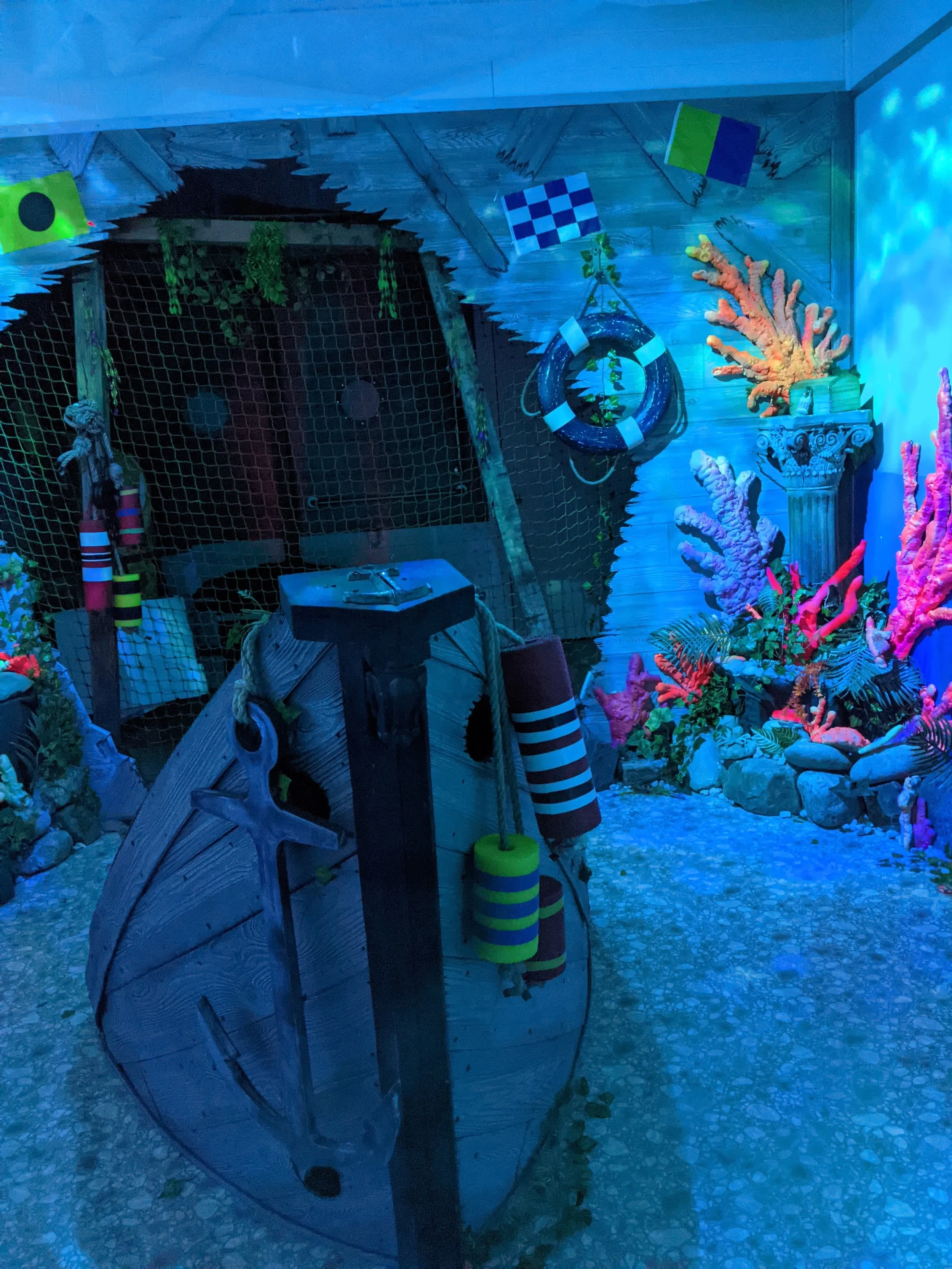 The first room of the Coral Kingdom Aquarium with a sunken ship.