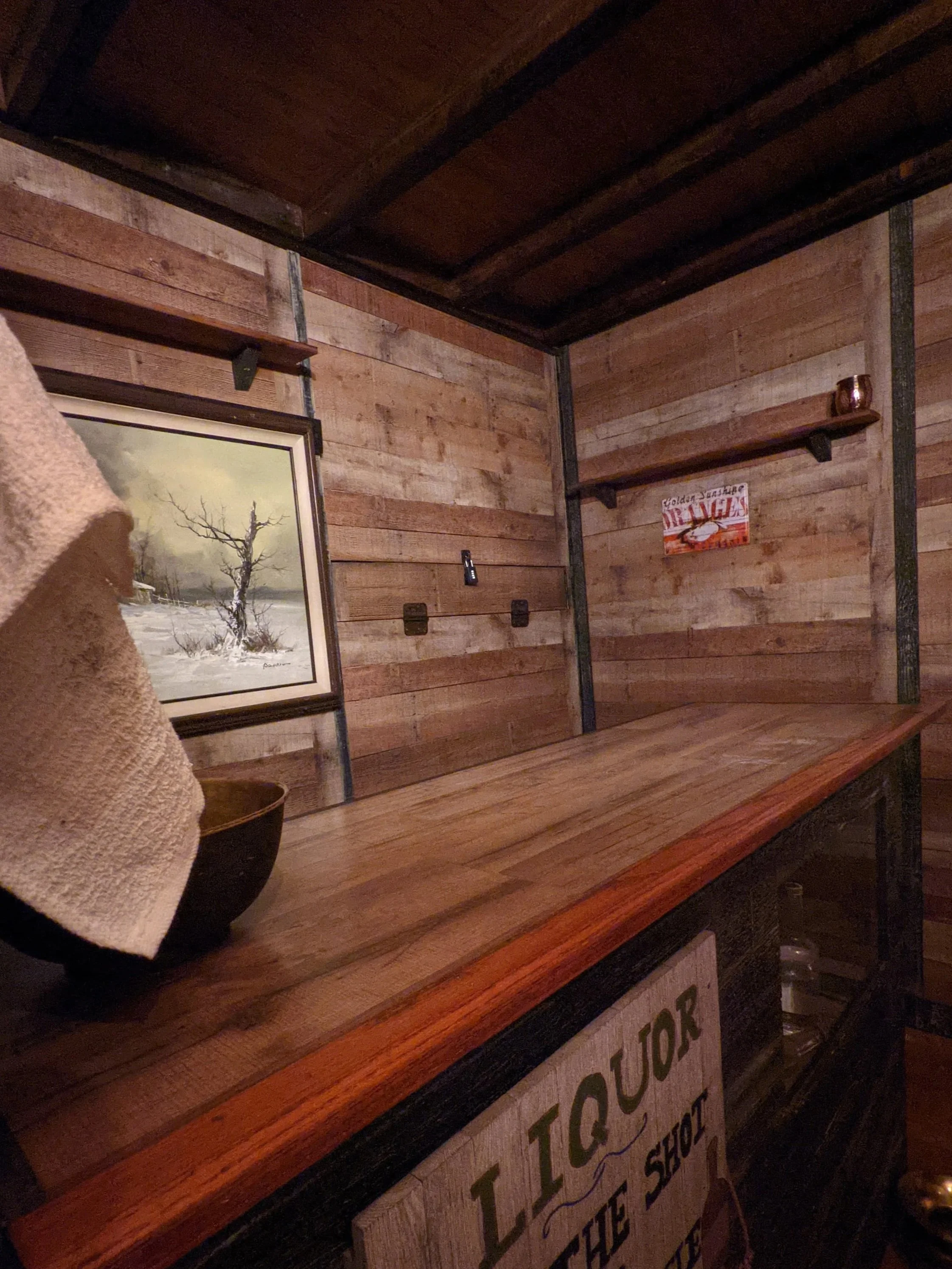 Interior of Deadwood Saloon positioned in front of an old wooden bar.