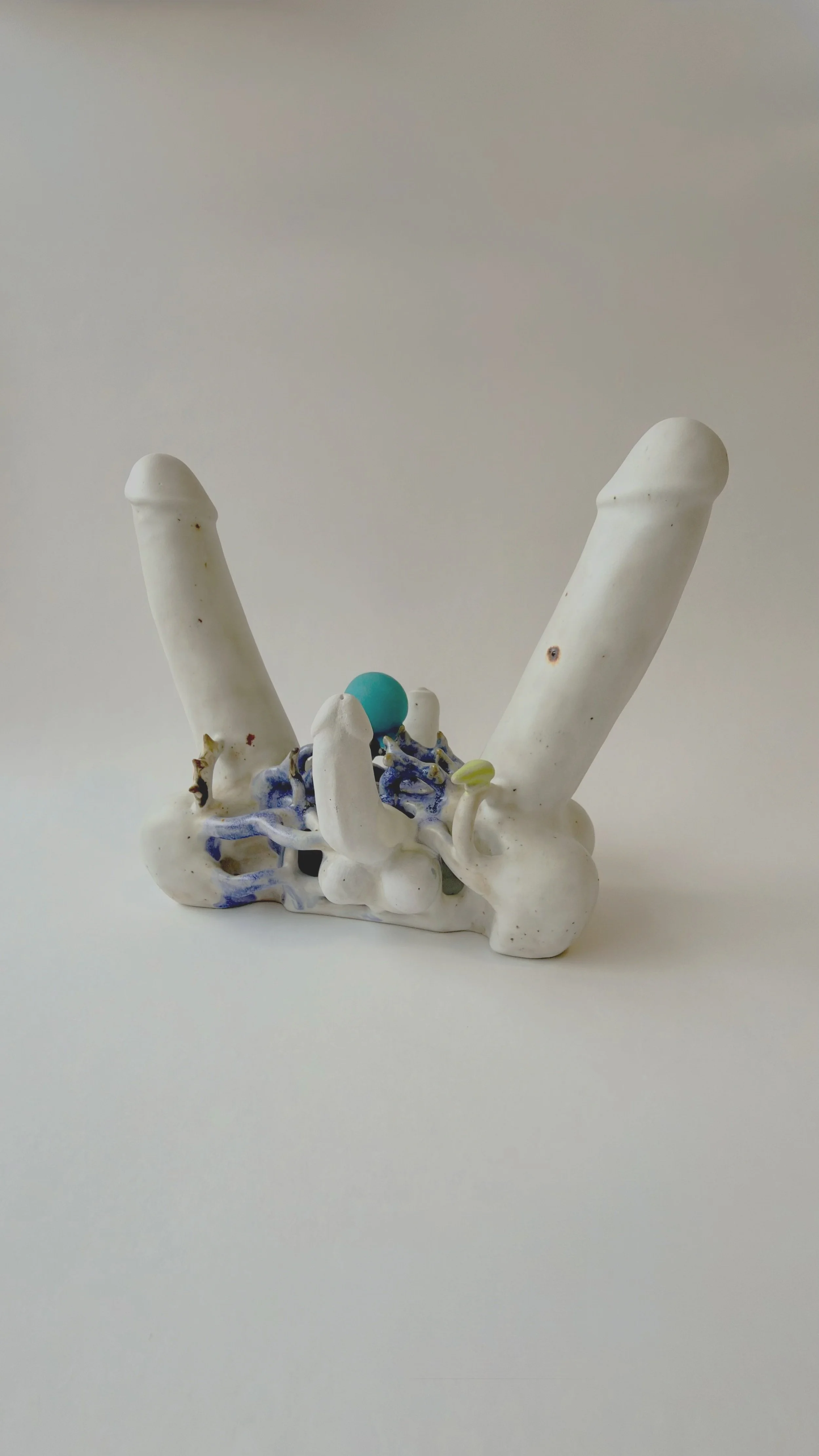 Hand-built ceramic sculpture Perpetual Adoration placed on a neutral surface.