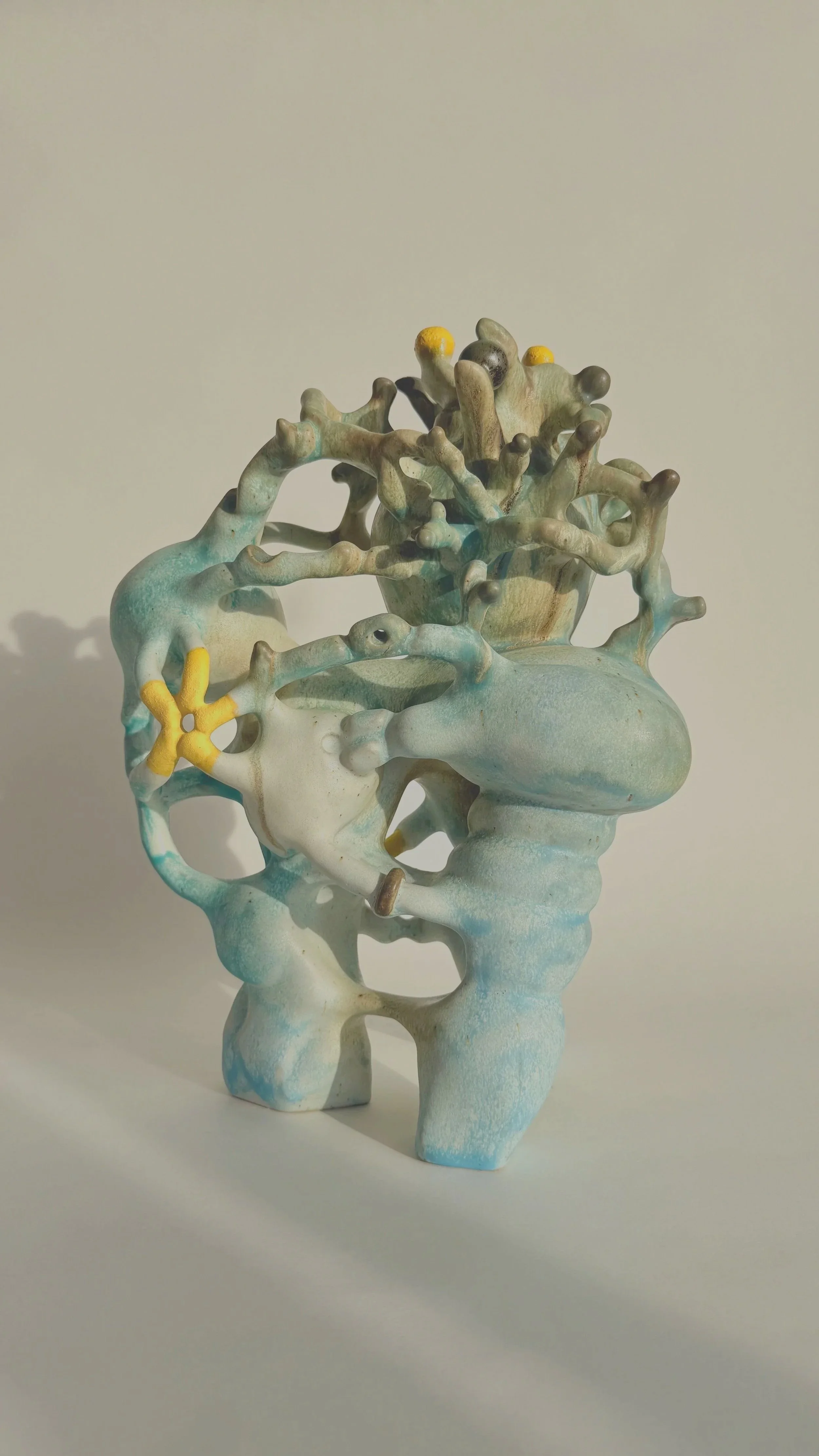 Hand-built stoneware sculpture El Cargador on a neutral background.