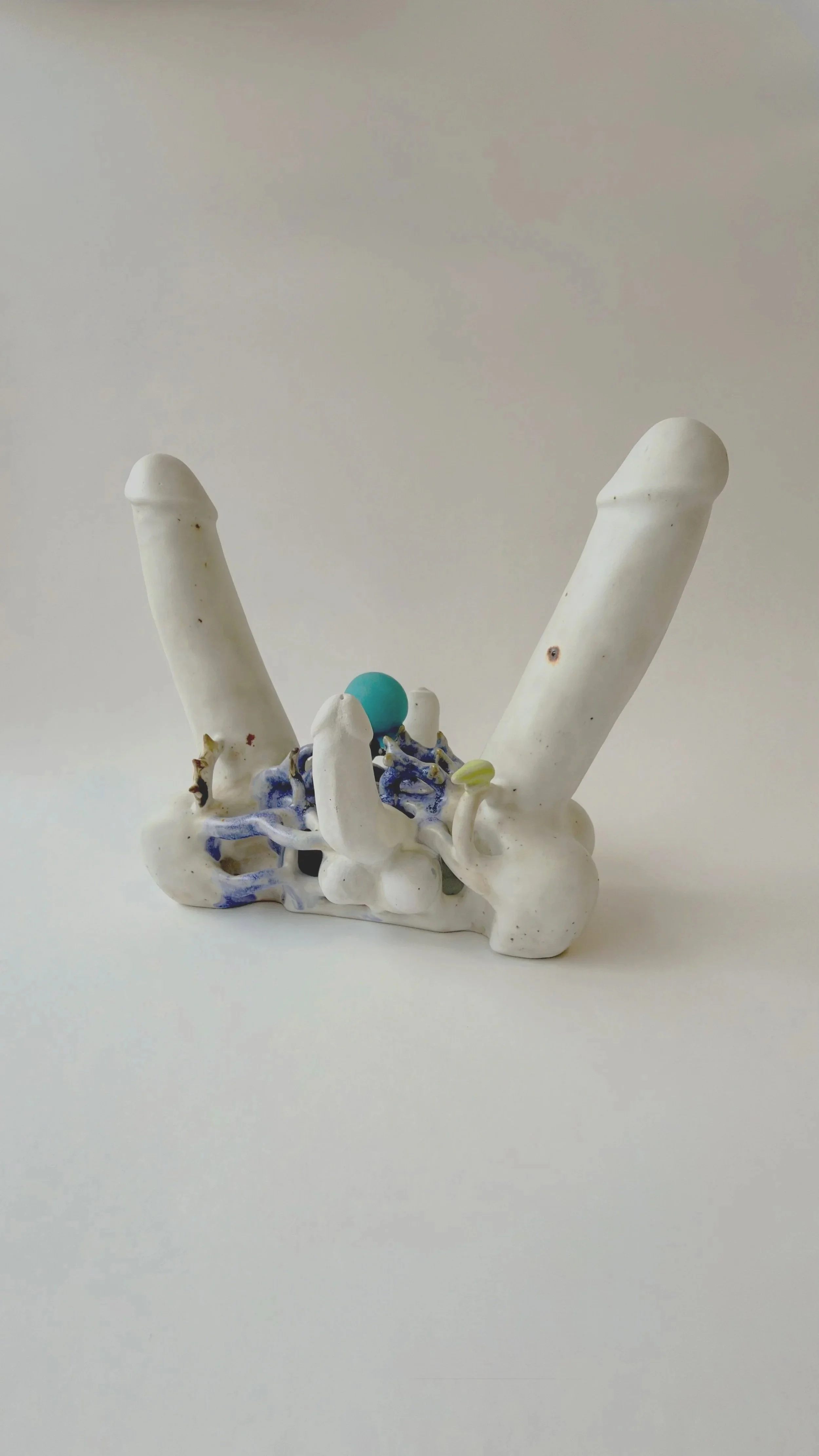 Hand-built ceramic sculpture Perpetual Adoration placed on a neutral surface.