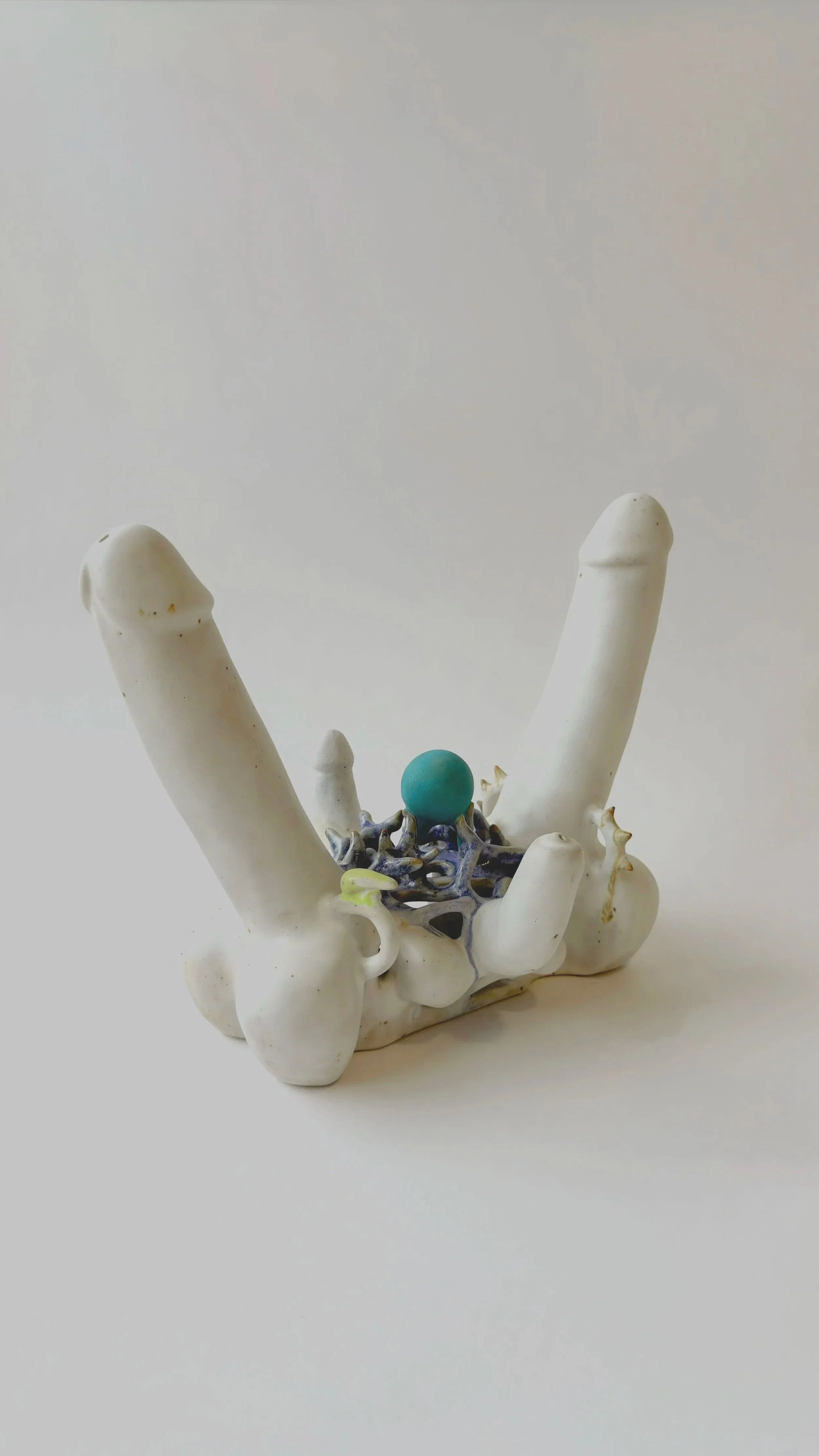 Hand-built ceramic sculpture Perpetual Adoration placed on a neutral surface.