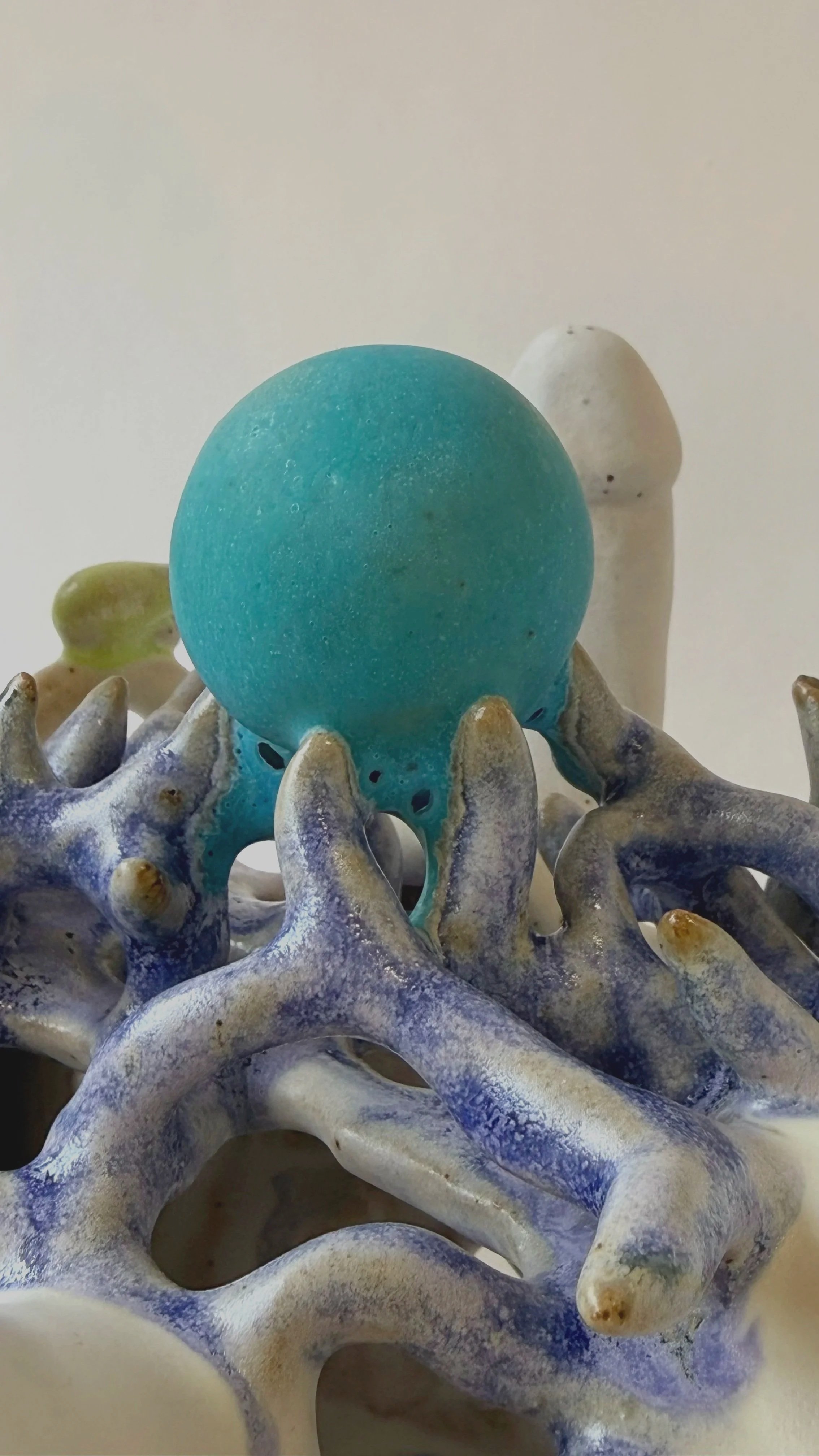 Close-up detail of the surface texture on hand-built ceramic sculpture Perpetual Adoration.